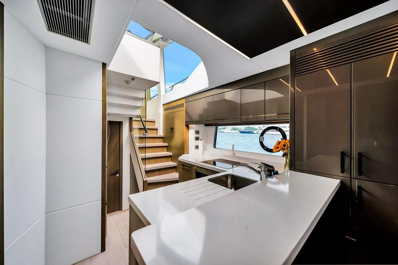 a kitchen with a large island aboard BELLOW DECK Yacht for Sale