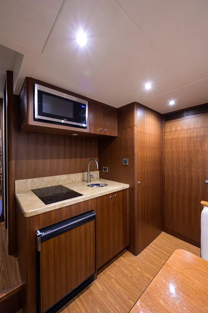 a kitchen with a microwave and a sink aboard ZEPHYR Yacht for Charter