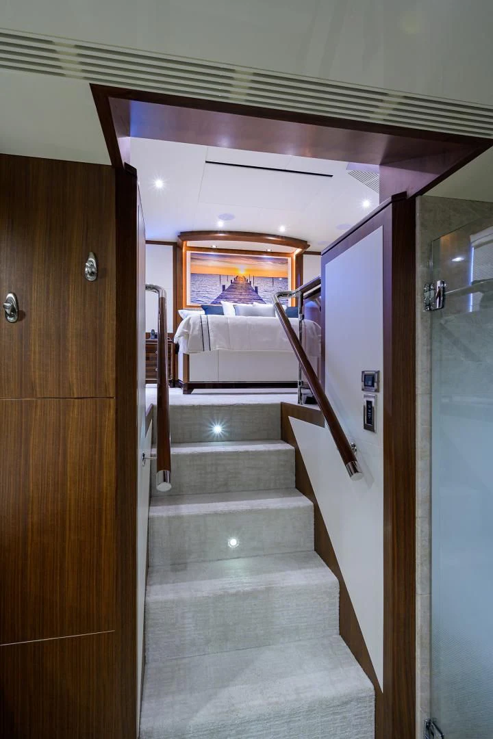 a bathroom with a white tub and wooden doors aboard ZEPHYR Yacht for Charter