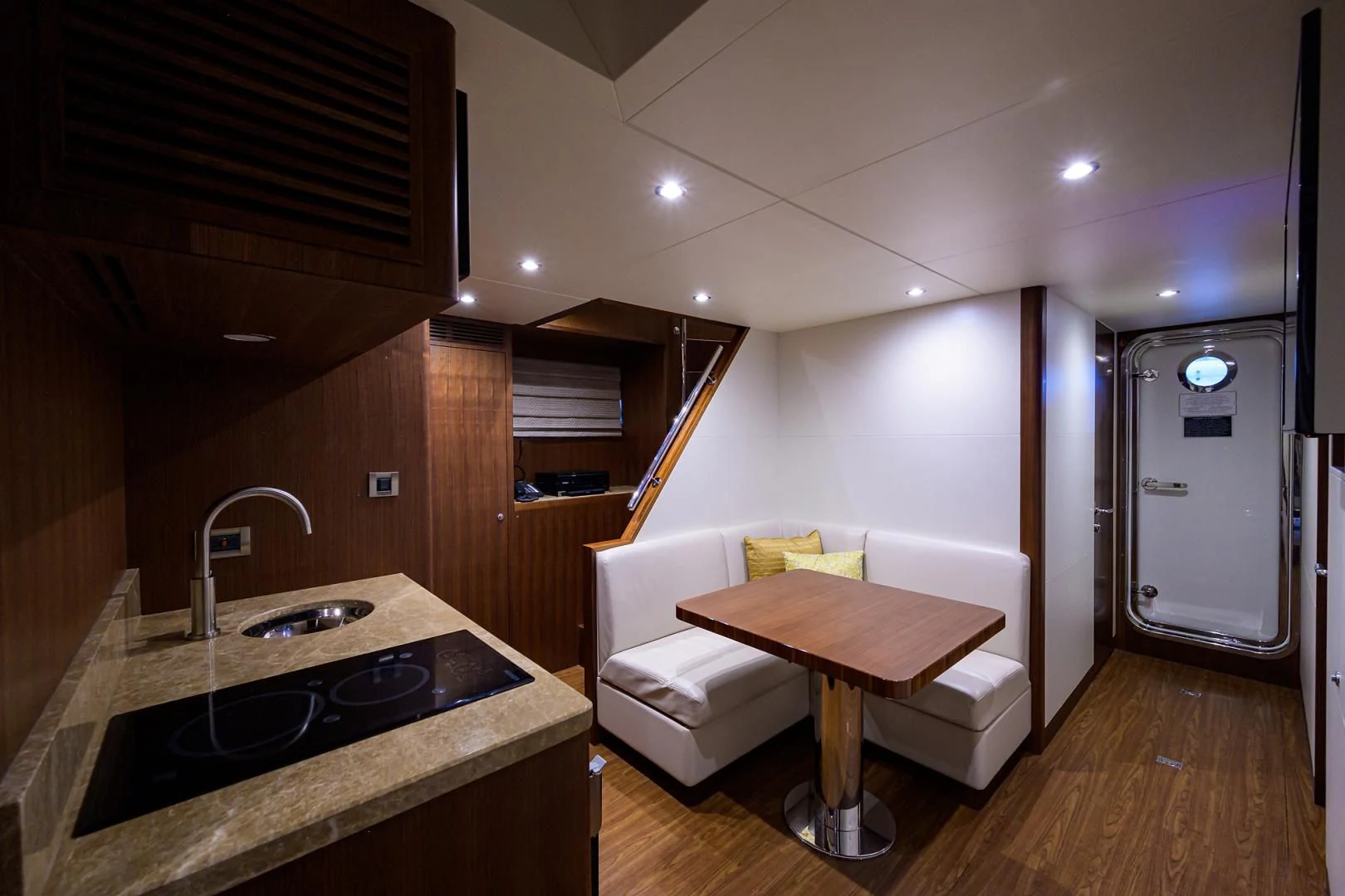 a bathroom with a sink and a bed aboard ZEPHYR Yacht for Charter