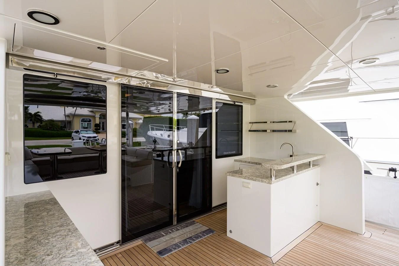 a modern kitchen with glass doors aboard ZEPHYR Yacht for Charter