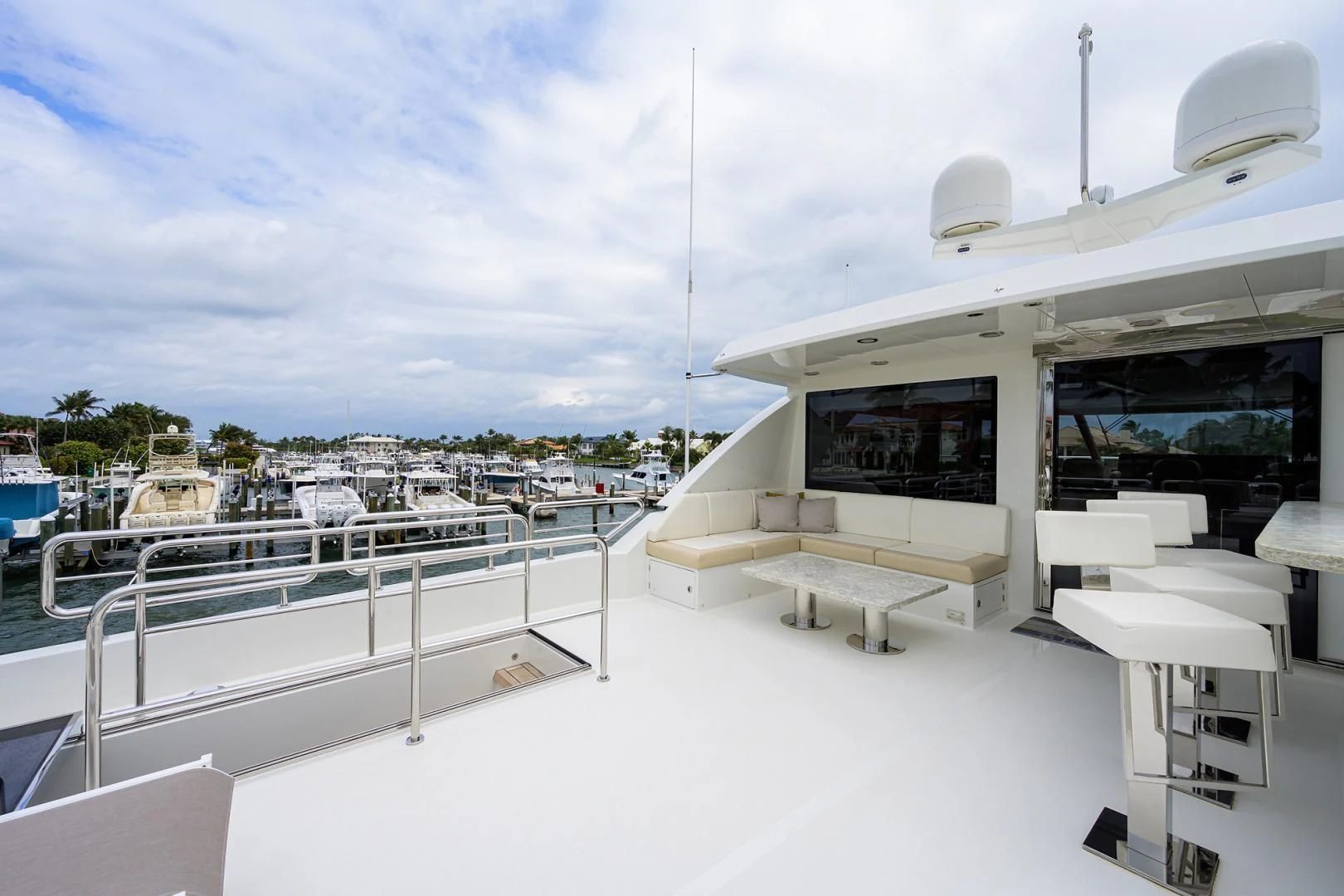 a white building with white rooftops and a bench and a pool aboard ZEPHYR Yacht for Charter