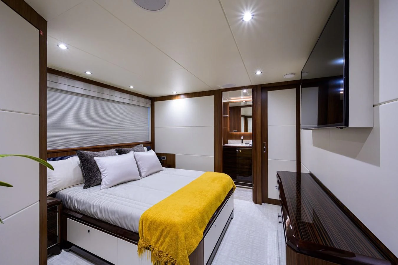 a room with a bed and a closet aboard ZEPHYR Yacht for Charter