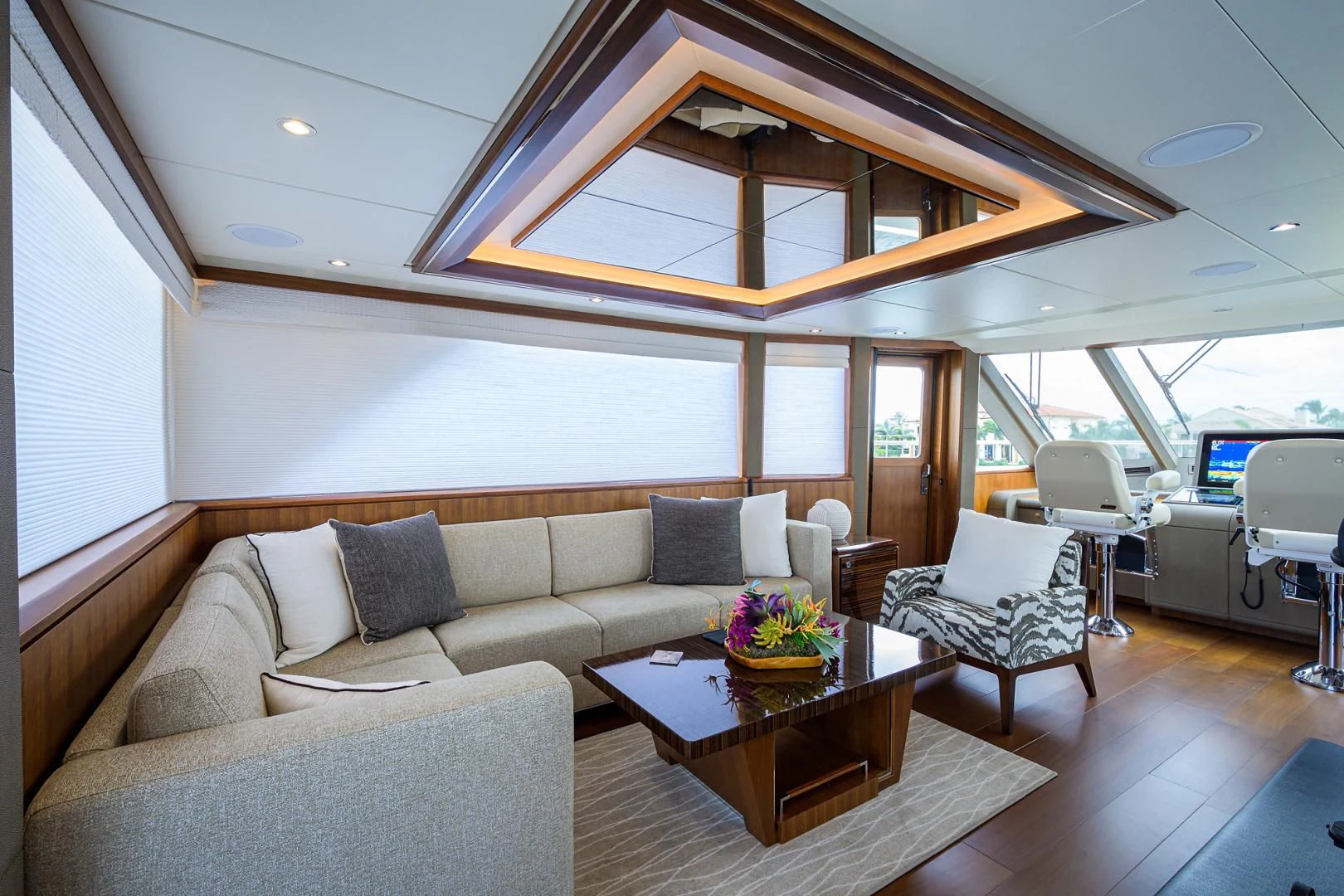 a living room with a couch and a table aboard ZEPHYR Yacht for Charter