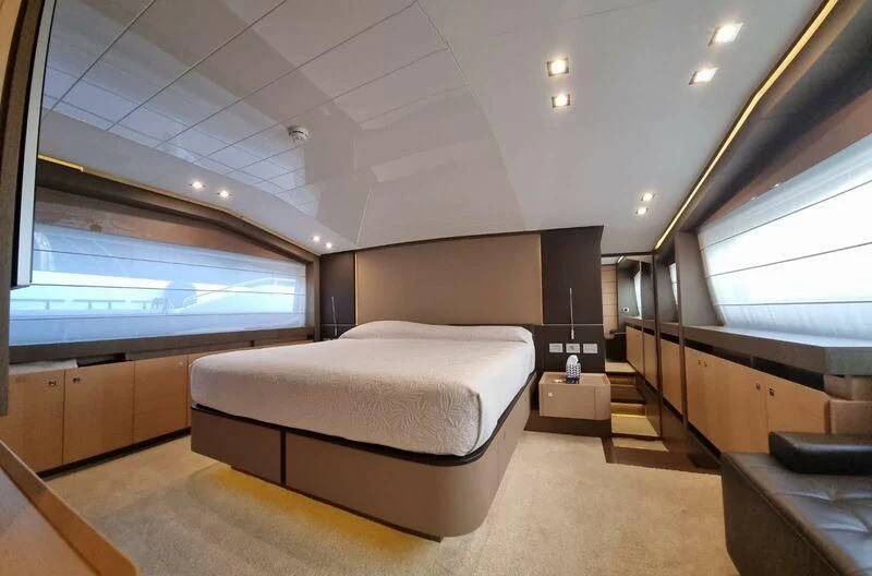a room with a bed and a window aboard NENA Yacht for Sale