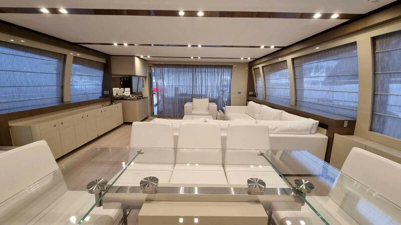 a large room with a large white bed and a large window aboard NENA Yacht for Sale
