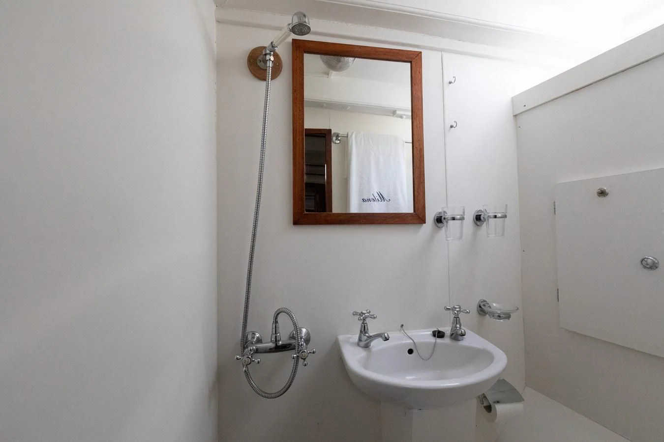 a bathroom with a mirror and sink aboard MILENA Yacht for Sale