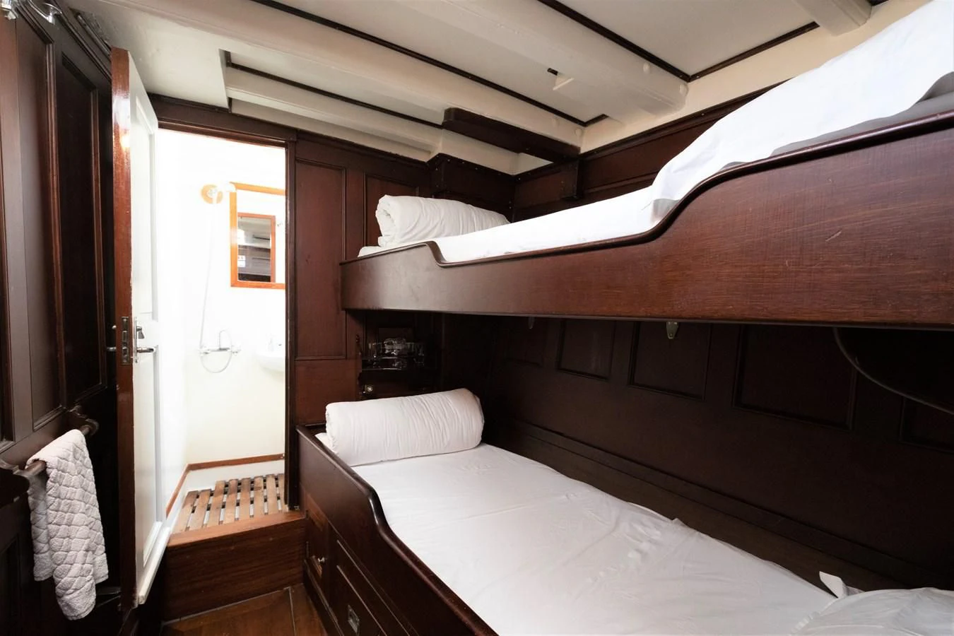 a room with a bed and a mirror aboard MILENA Yacht for Sale
