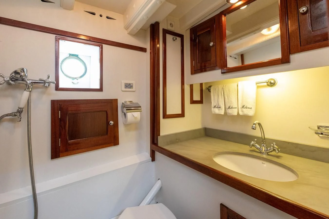 a bathroom with a sink and a mirror aboard MILENA Yacht for Sale