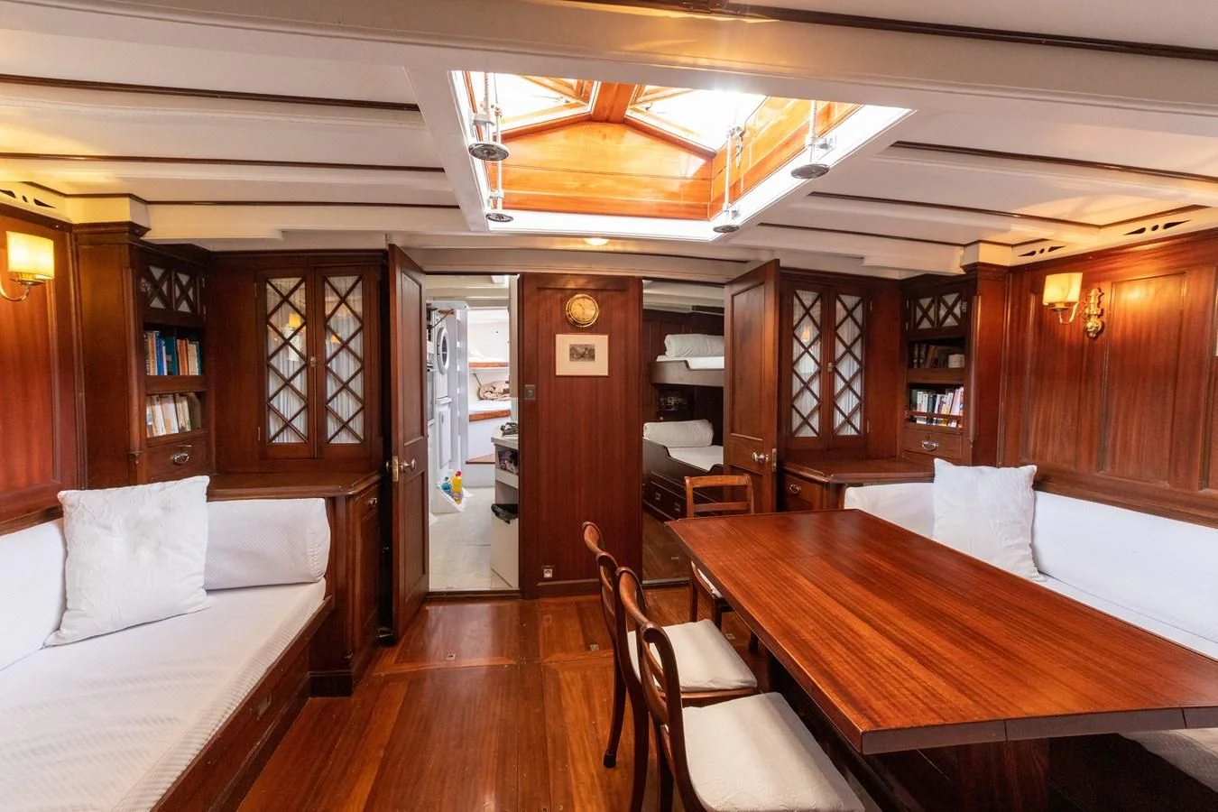 a room with a bed and a table aboard MILENA Yacht for Sale
