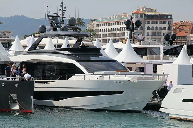 a boat docked at a pier aboard LILY Yacht for Sale