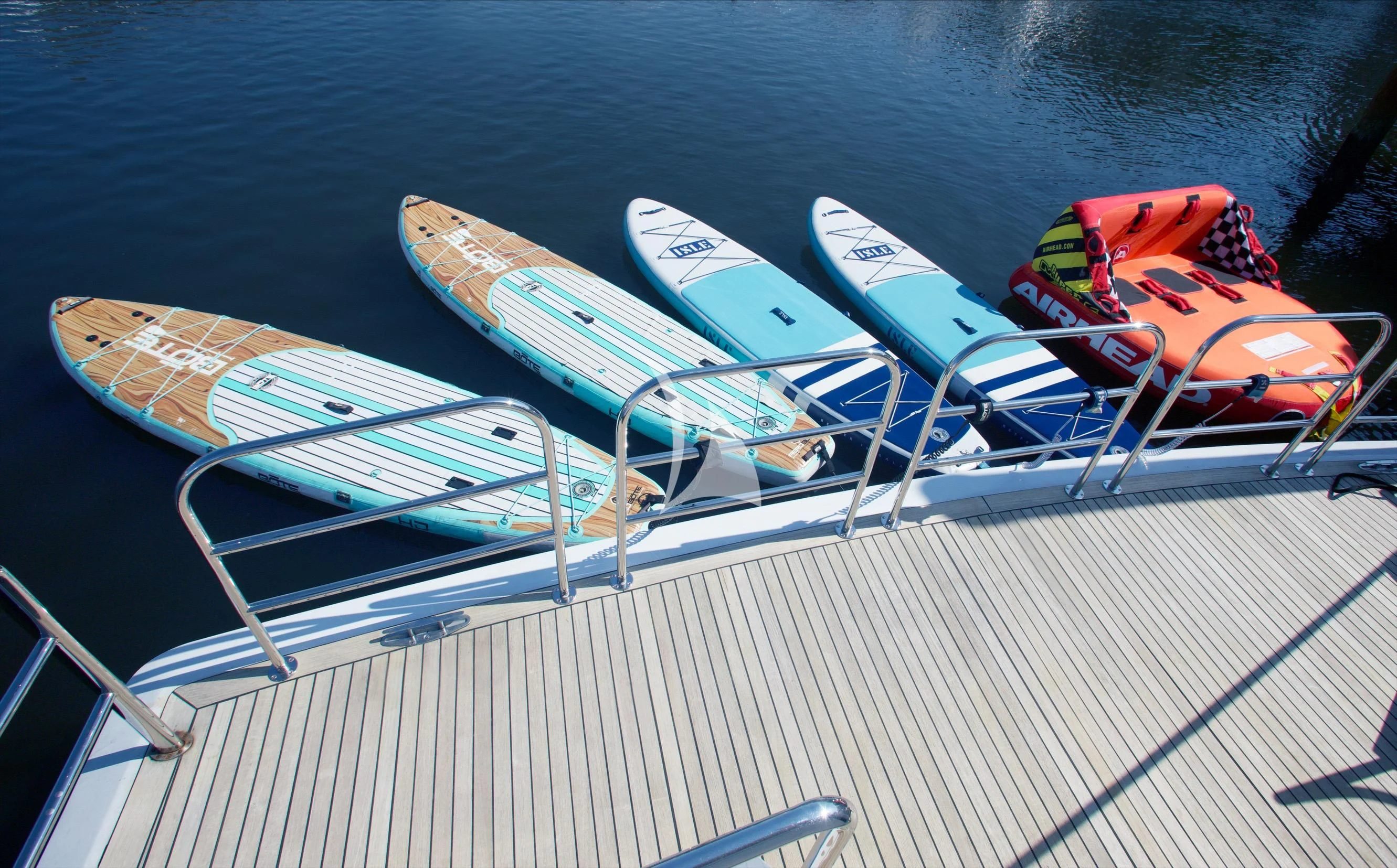 a boat with paddles on the deck aboard XOXO Yacht for Charter