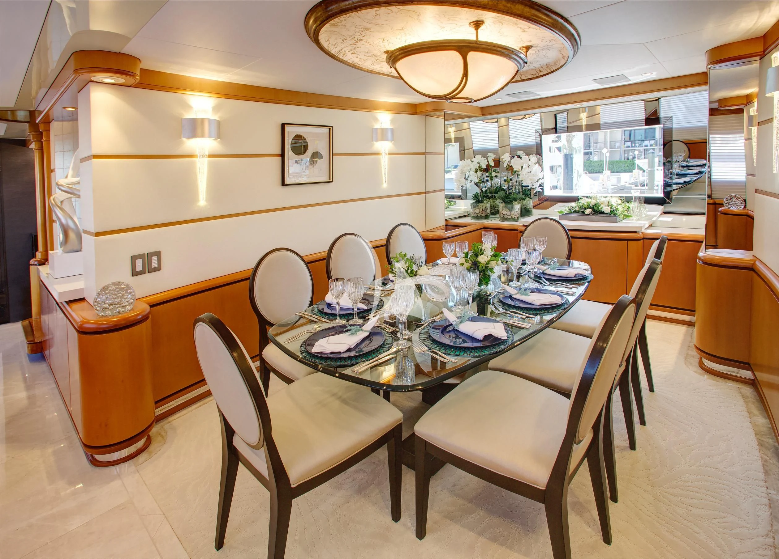 a dining room with a table and chairs aboard XOXO Yacht for Charter