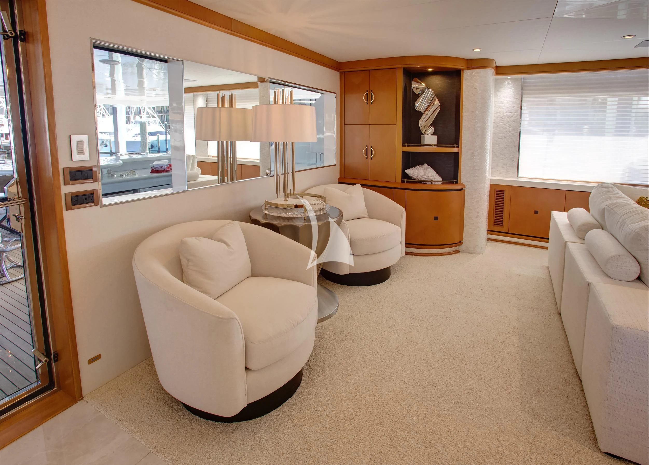 a living room with a couch and a table aboard XOXO Yacht for Charter