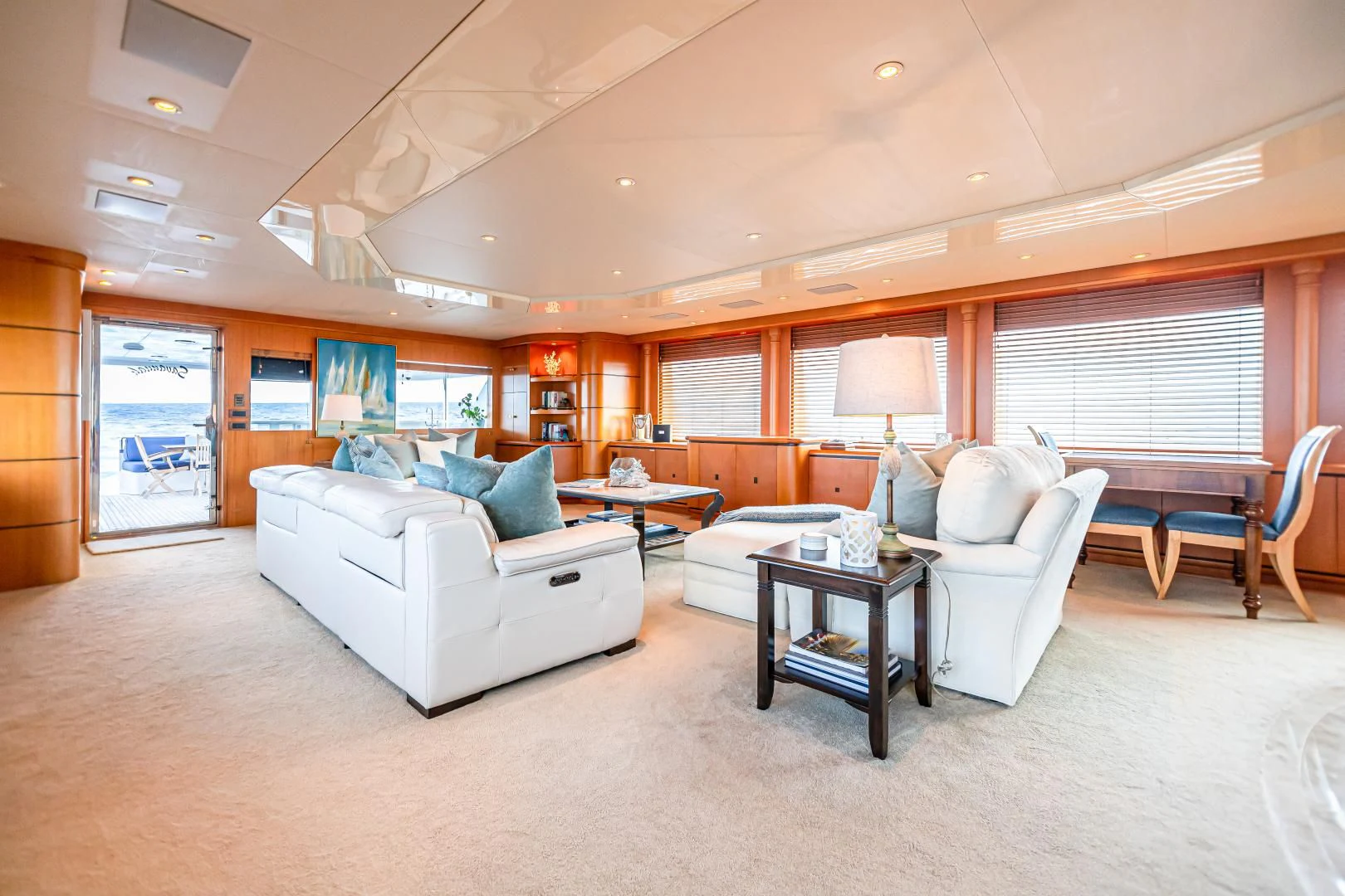 a living room with a couch and a table aboard XOXO Yacht for Charter