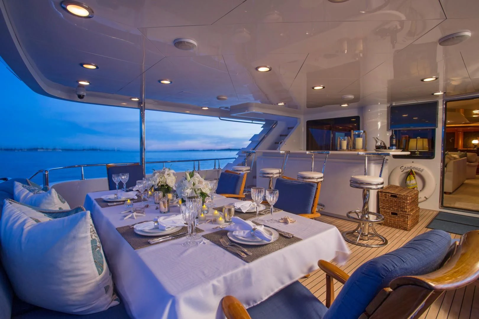 a table set for a dinner aboard XOXO Yacht for Charter