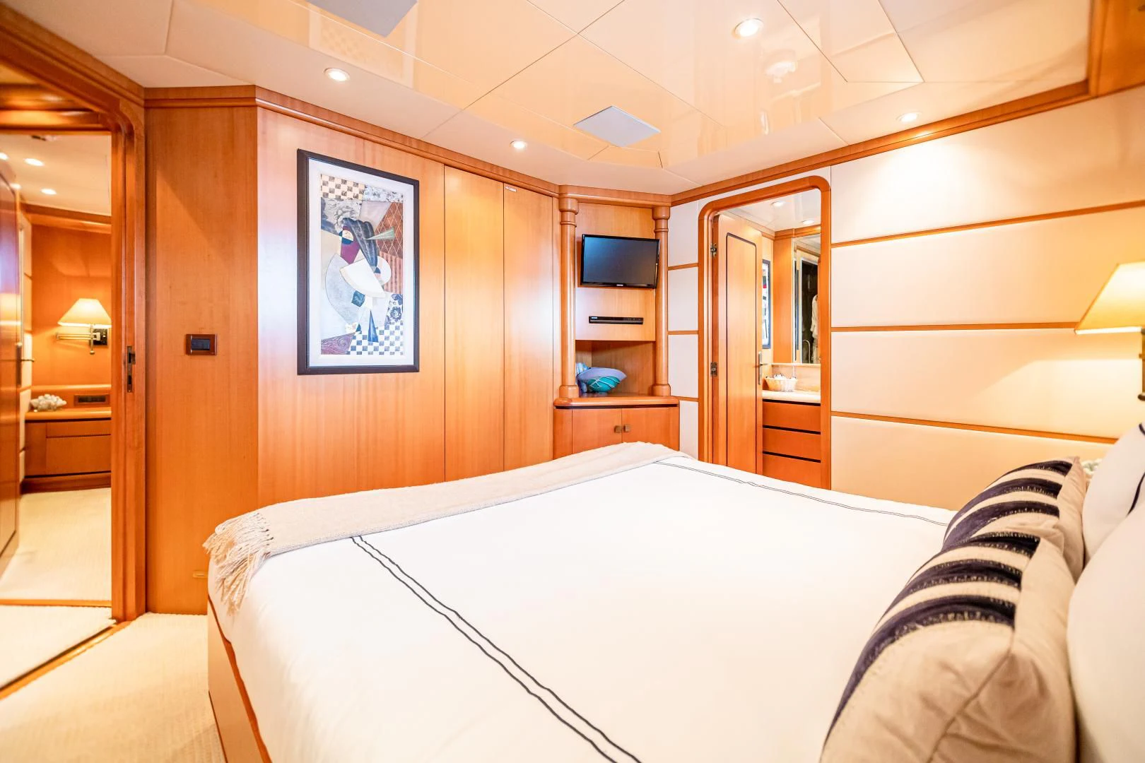 a bedroom with a bed aboard XOXO Yacht for Charter