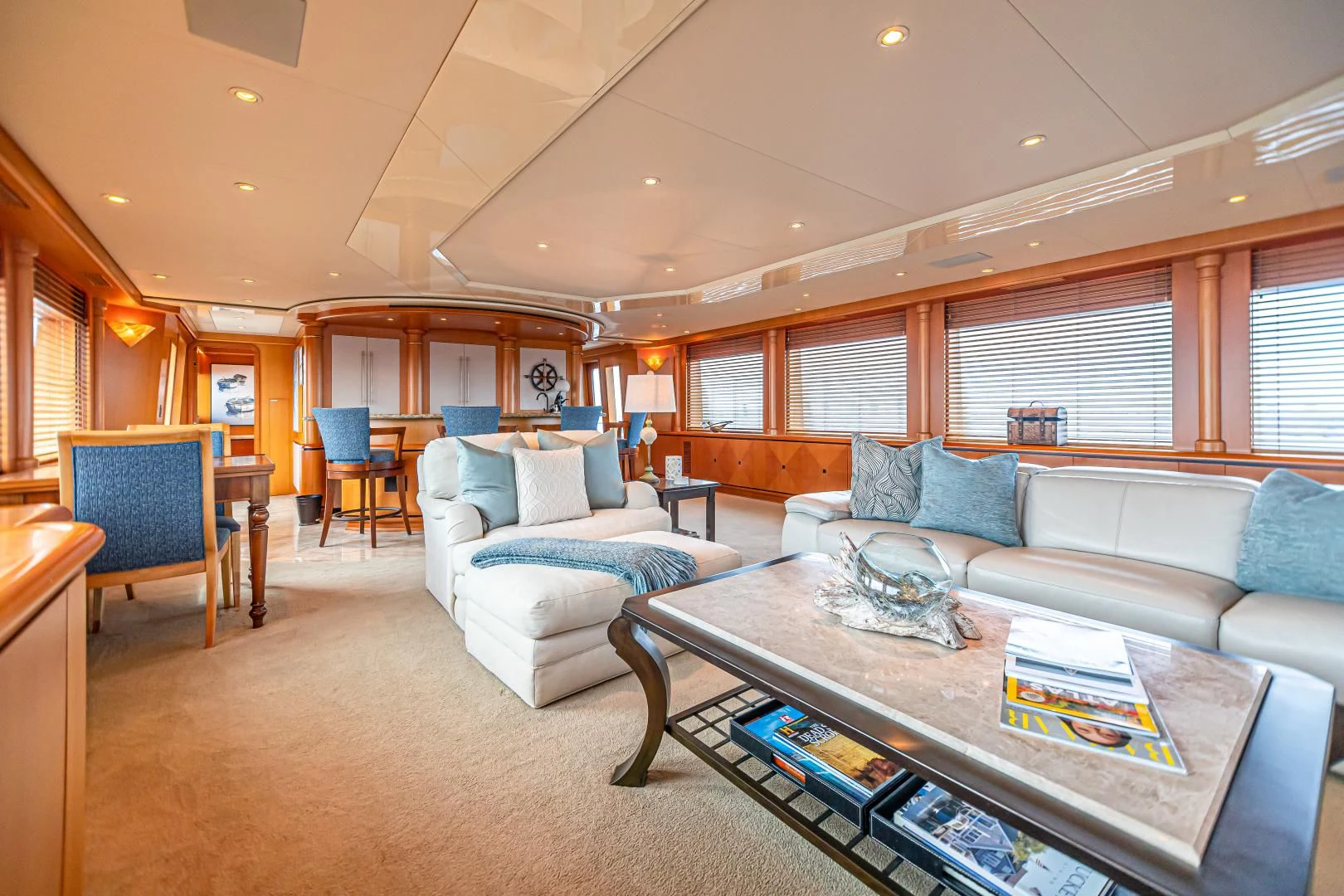 a living room with a couch and a coffee table aboard XOXO Yacht for Charter