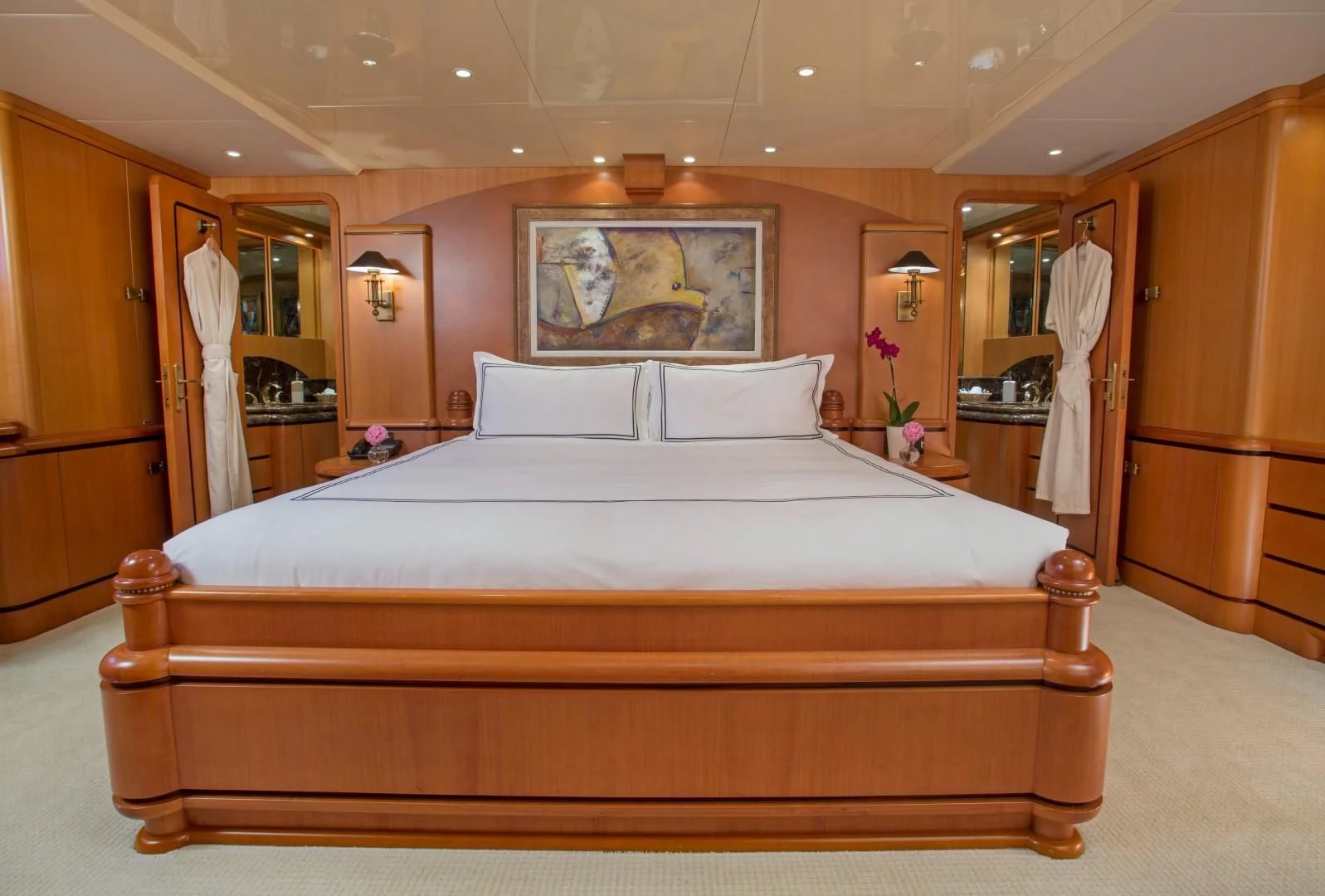 a bed in a hotel room aboard XOXO Yacht for Charter