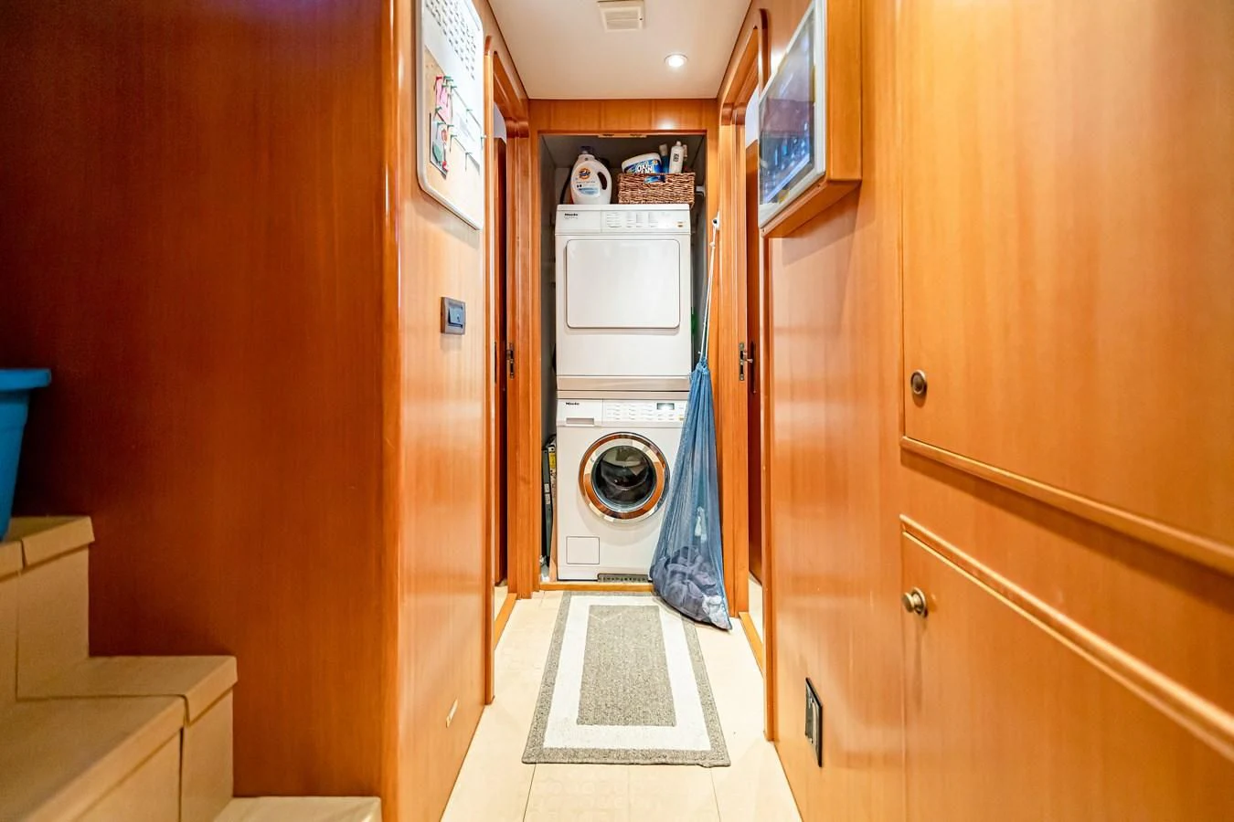 a washer and dryer in a room aboard XOXO Yacht for Charter