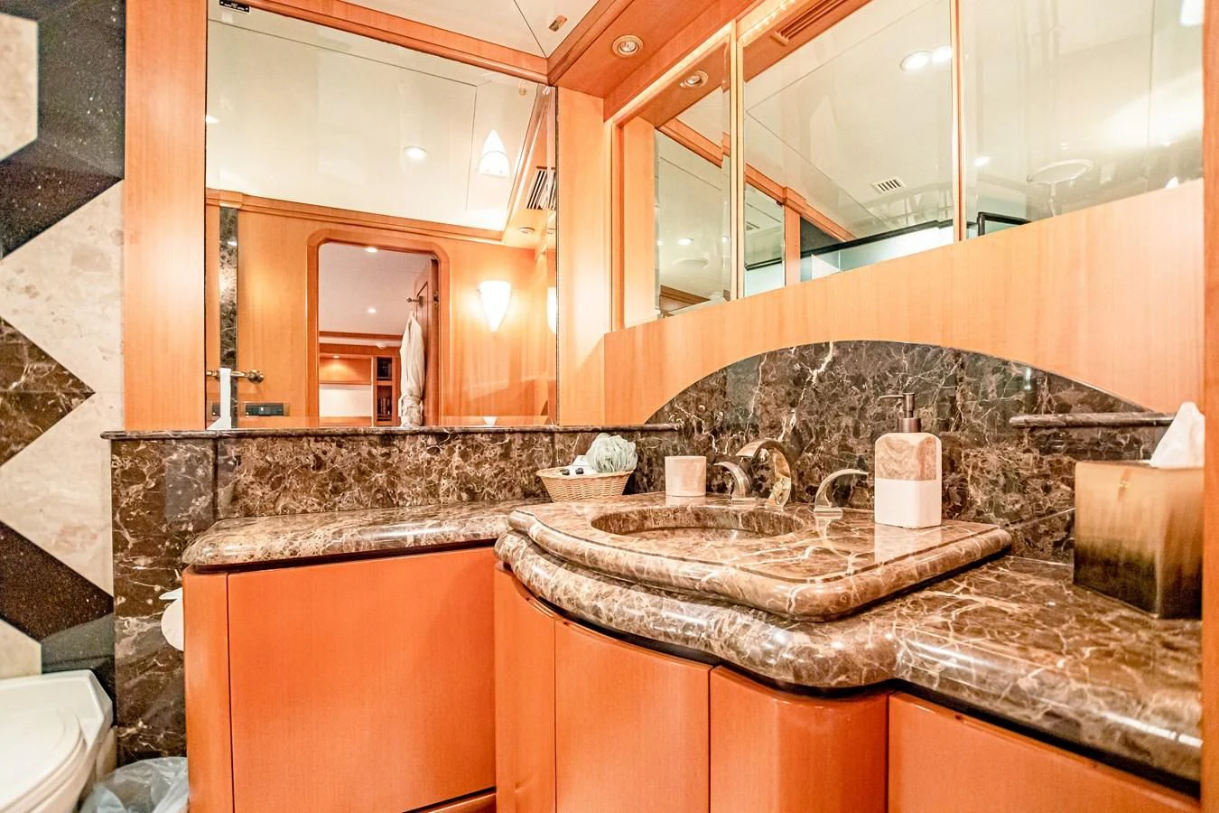 a bathroom with a large mirror aboard XOXO Yacht for Charter