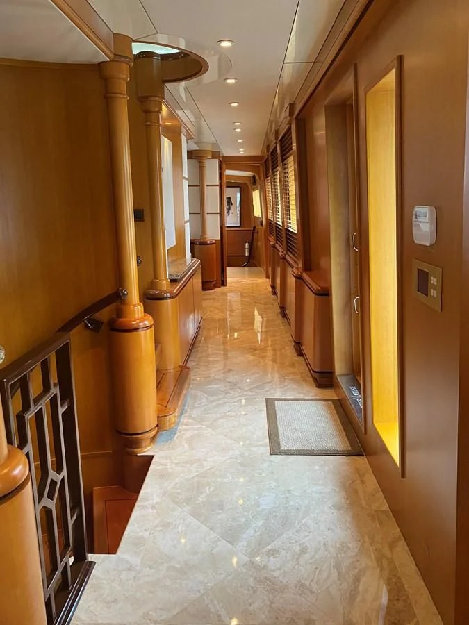 a hallway with a few doors aboard XOXO Yacht for Charter