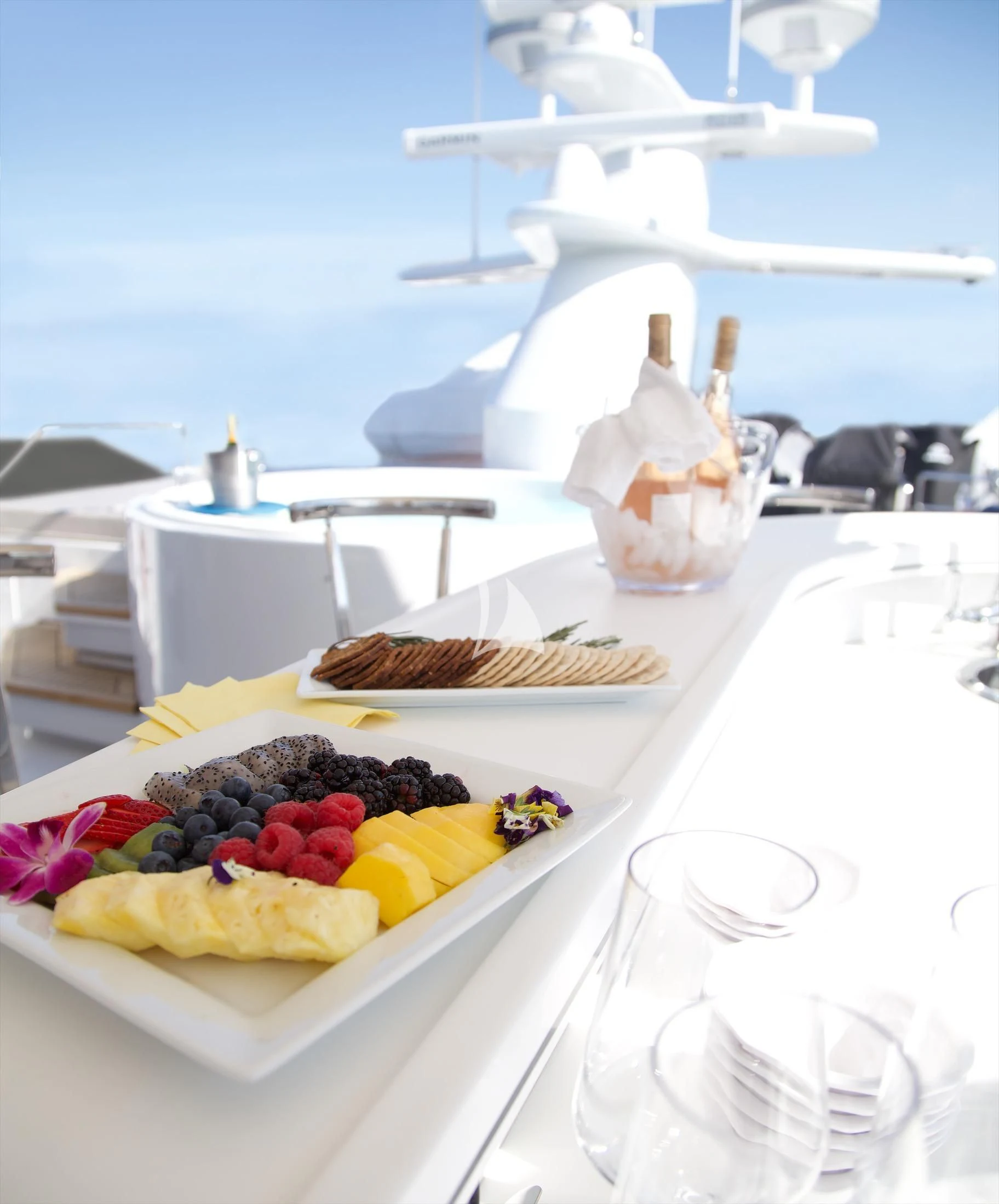 a plate of food on a table aboard XOXO Yacht for Charter