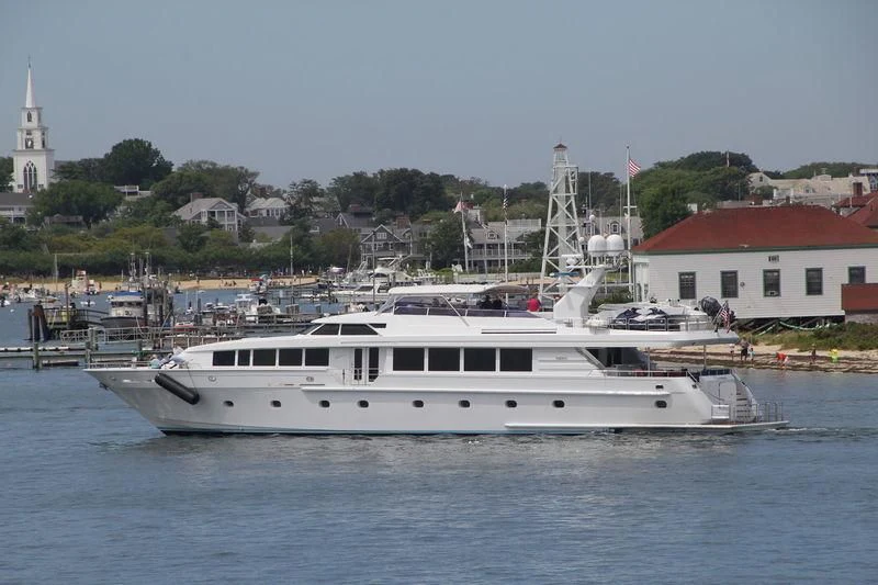 a white yacht in the water aboard XOXO Yacht for Charter