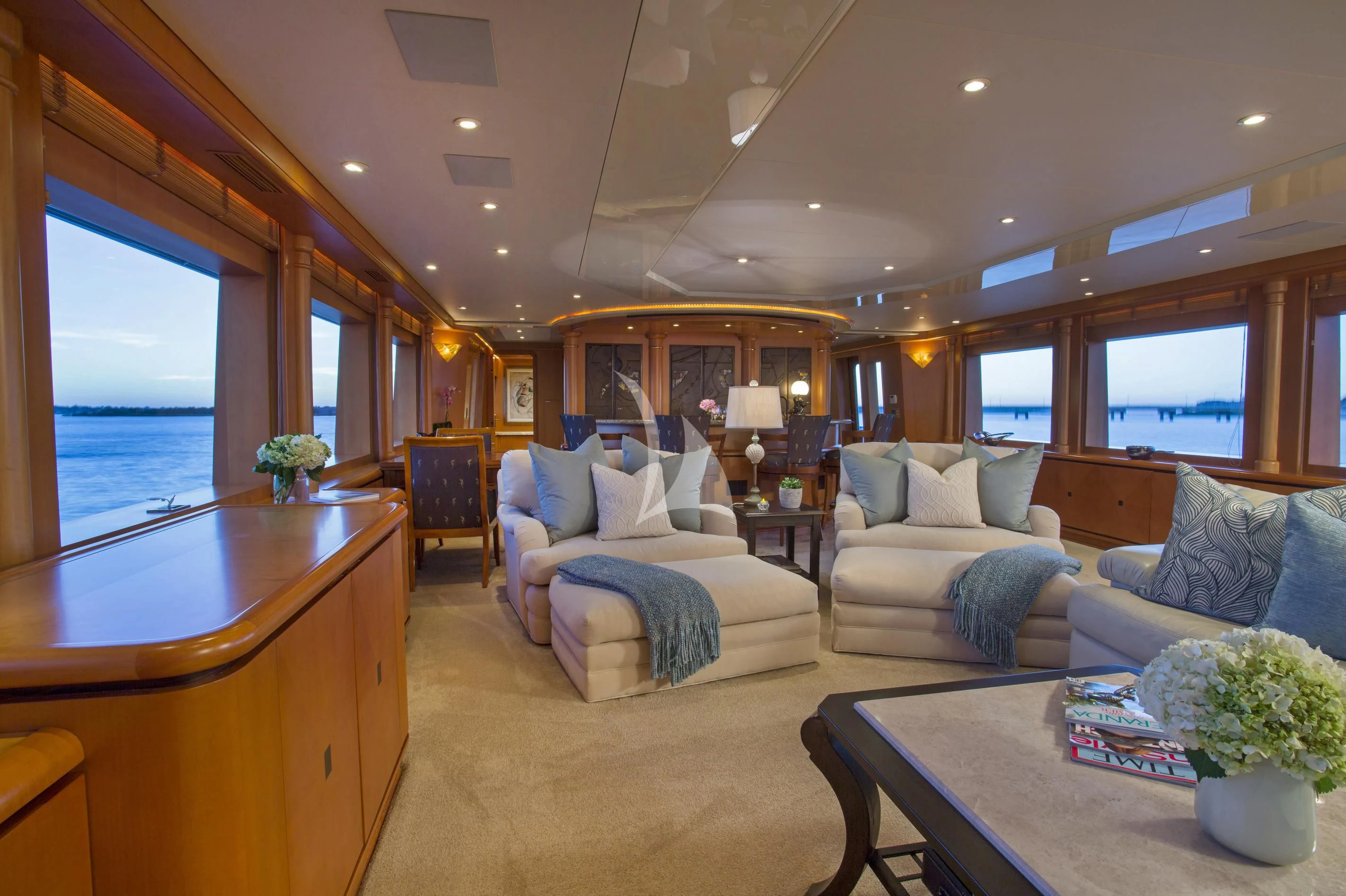 a living room with a large window aboard XOXO Yacht for Charter