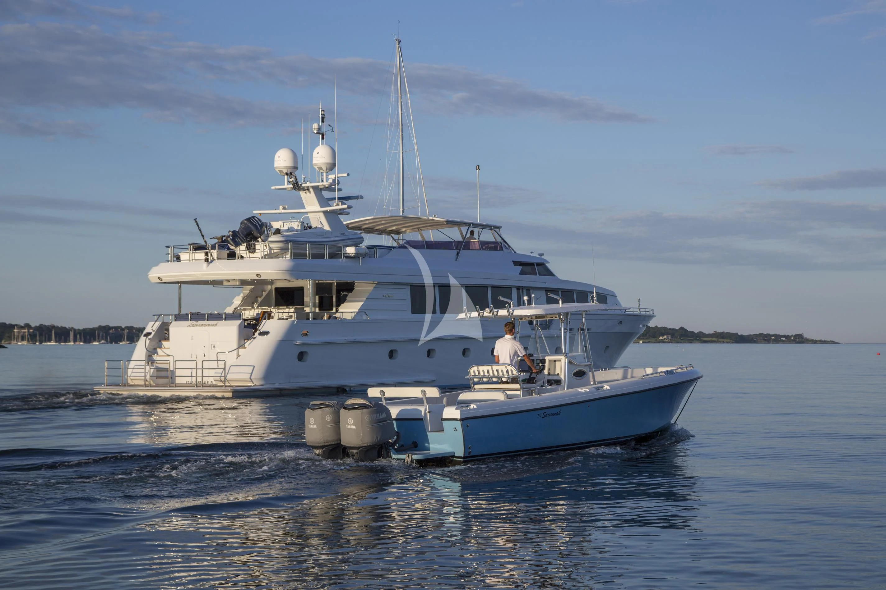 a large white boat in the water aboard XOXO Yacht for Charter