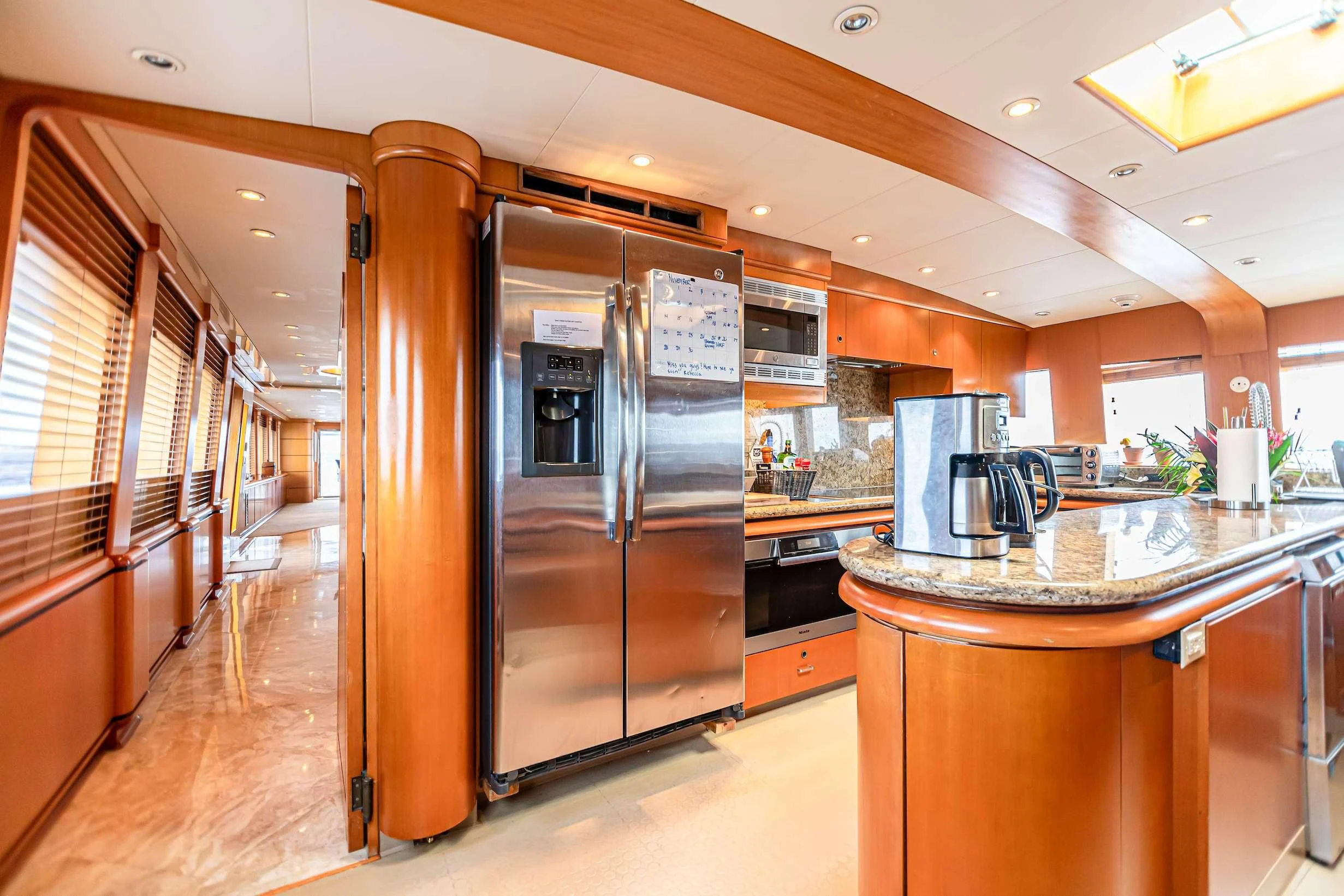 a kitchen with stainless steel appliances aboard XOXO Yacht for Charter