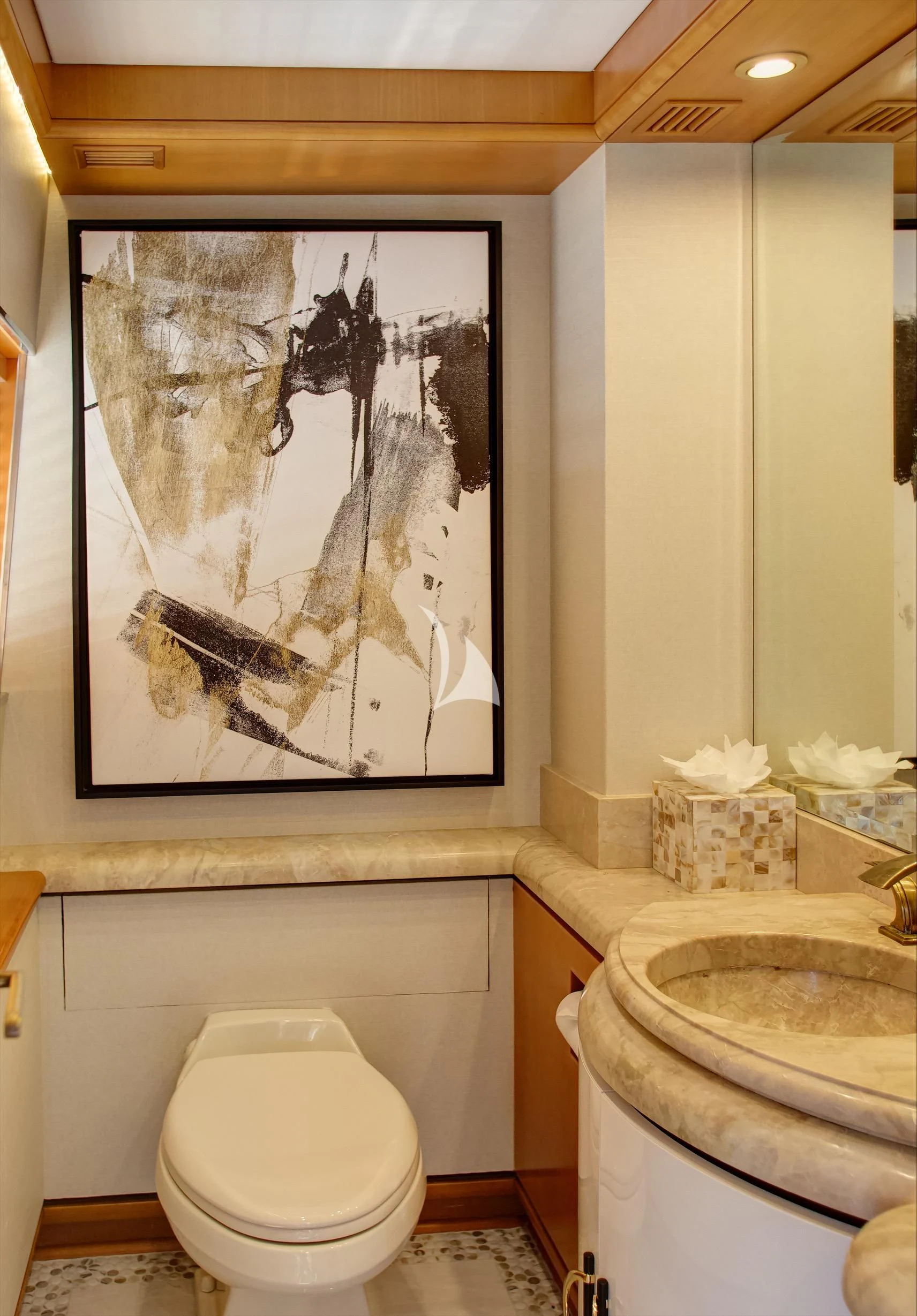 a bathroom with a painting on the wall aboard XOXO Yacht for Charter