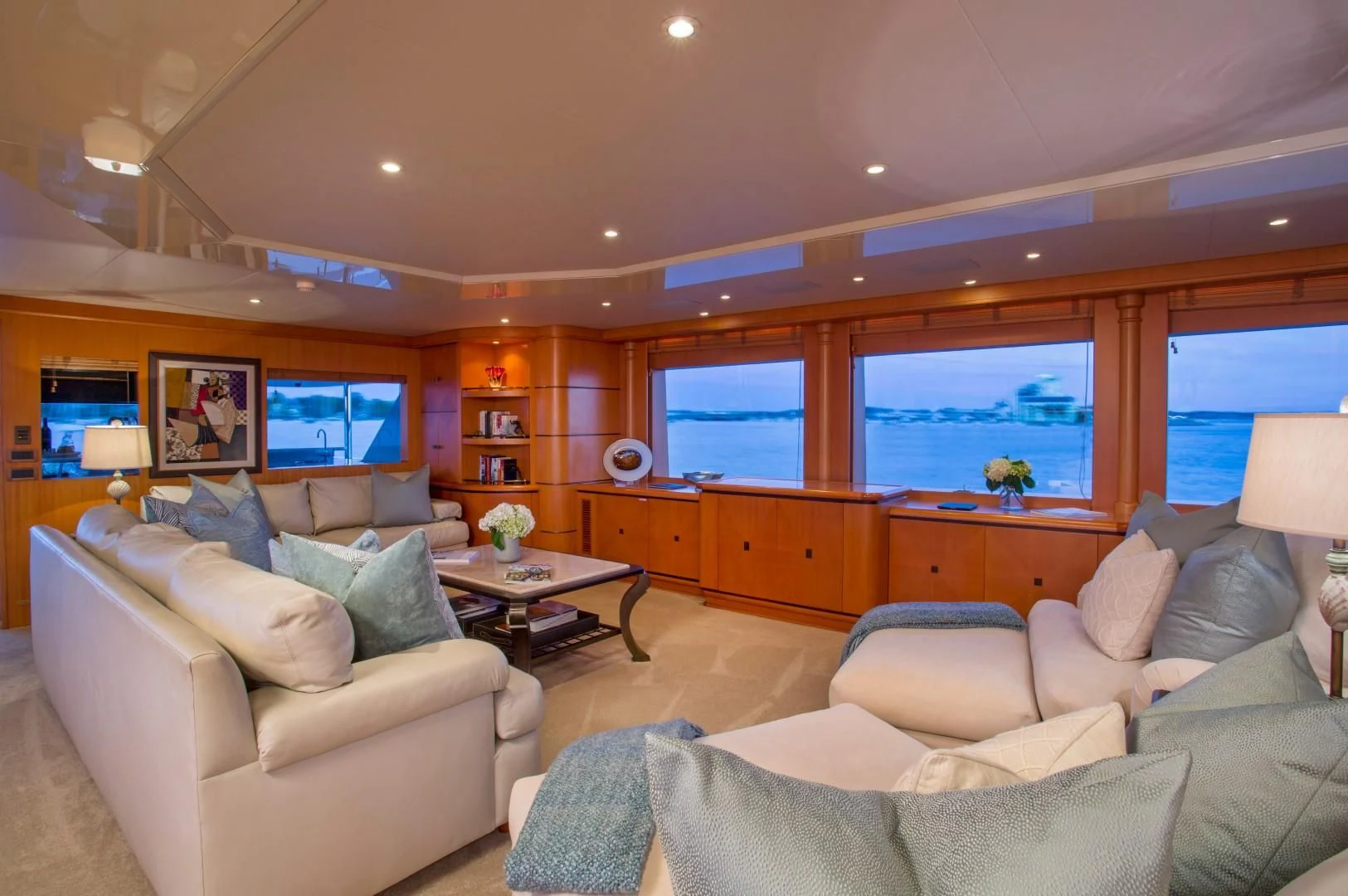 a living room with a large window aboard XOXO Yacht for Charter