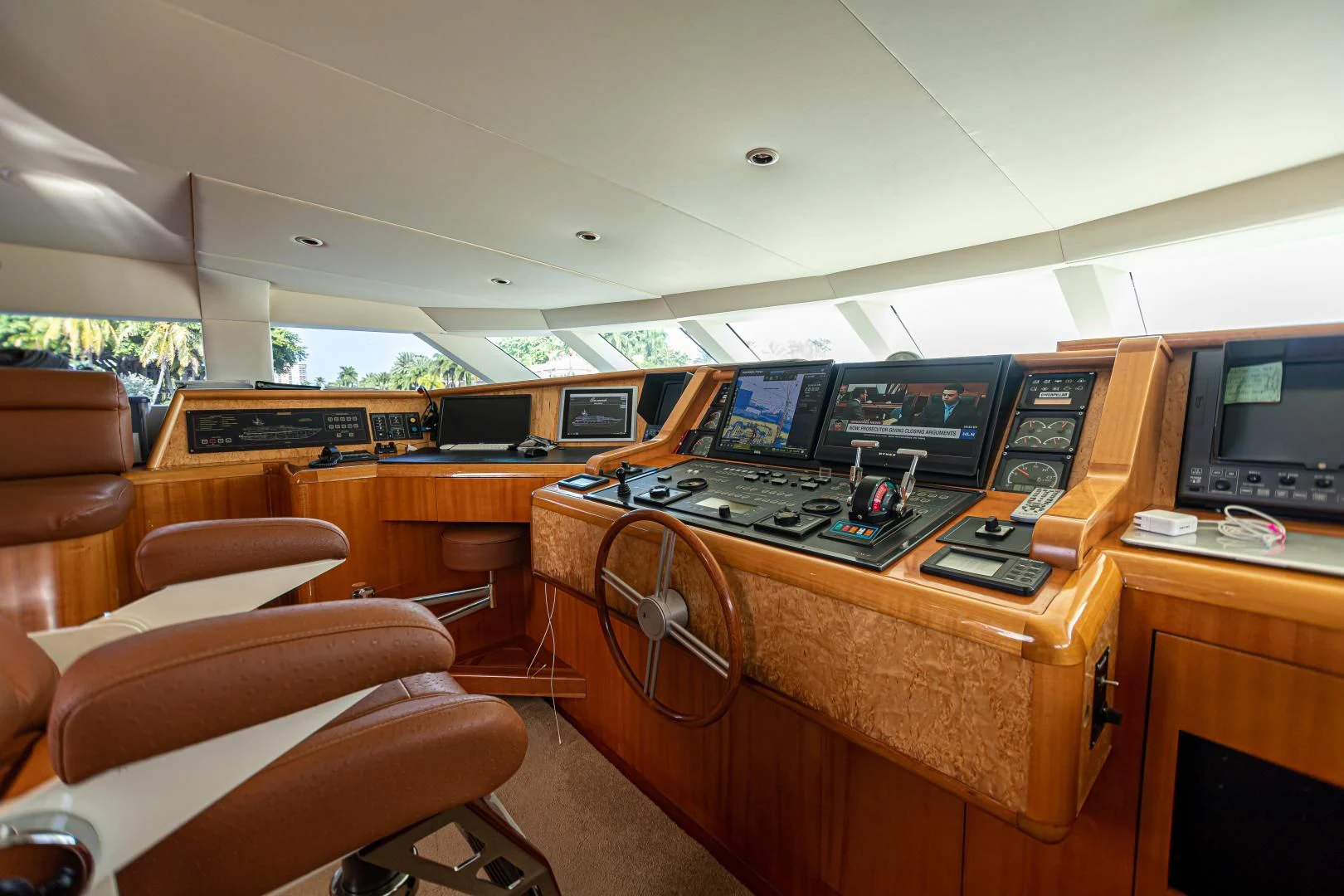 a room with computers and monitors aboard XOXO Yacht for Charter