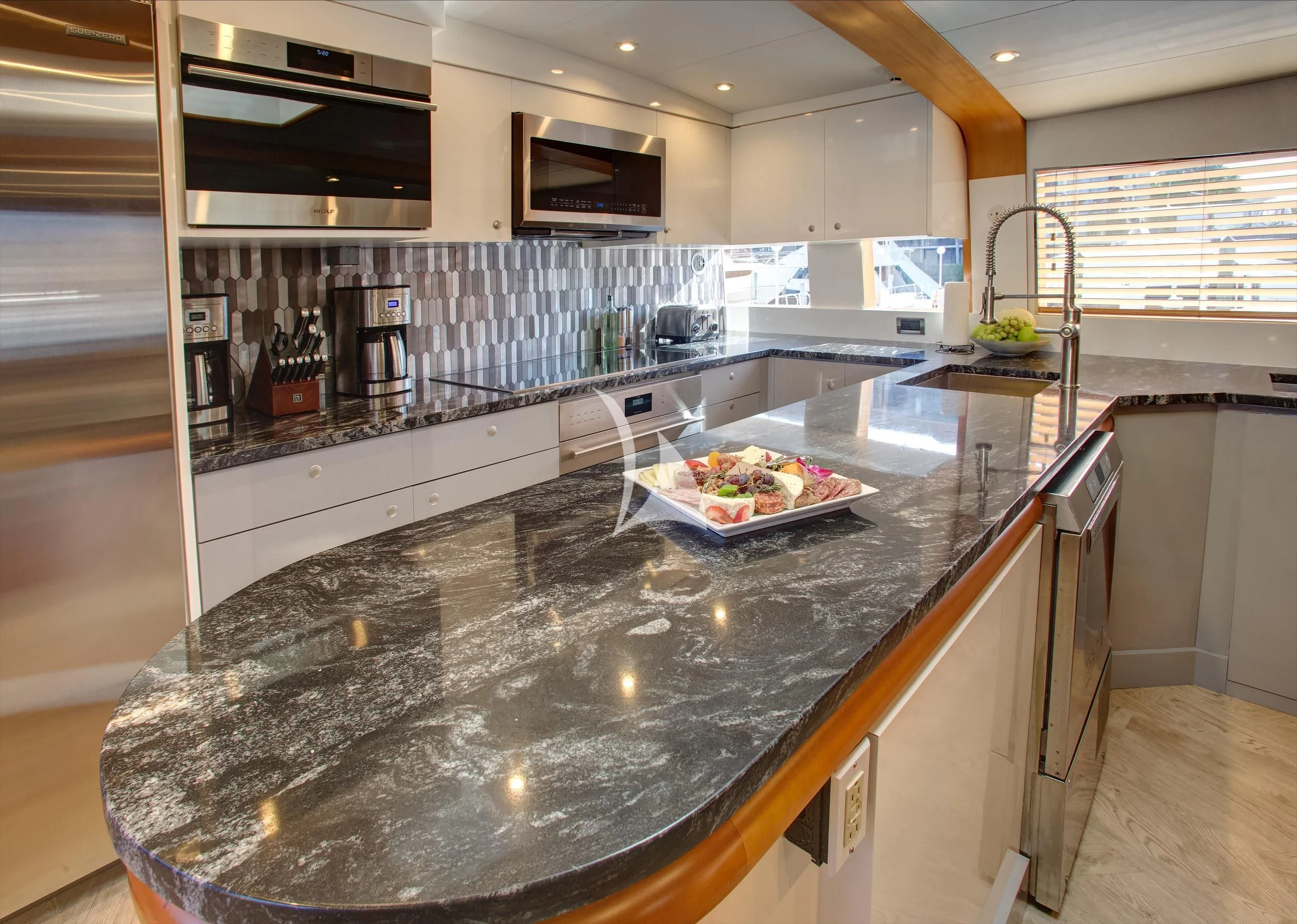 a kitchen with a countertop aboard XOXO Yacht for Charter