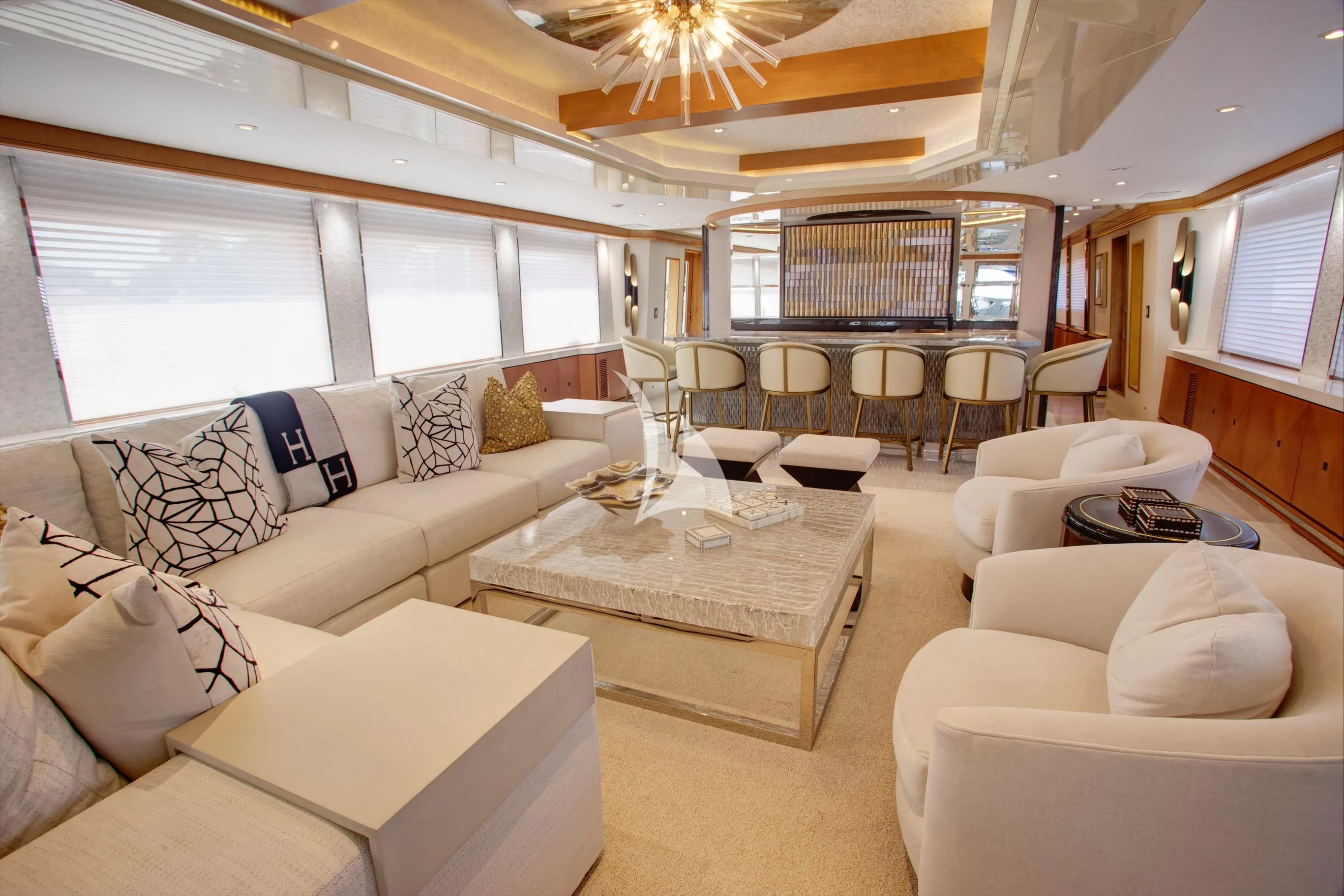 a living room with a couch and a coffee table aboard XOXO Yacht for Charter
