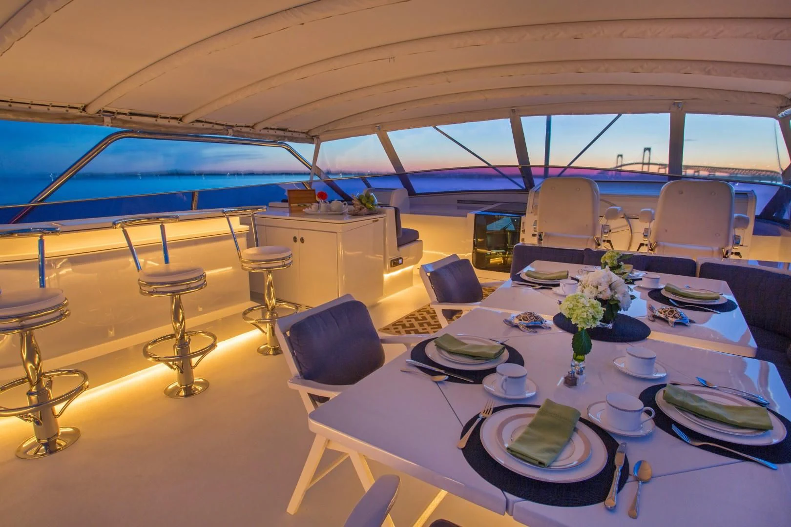 a dining room with a table set aboard XOXO Yacht for Charter