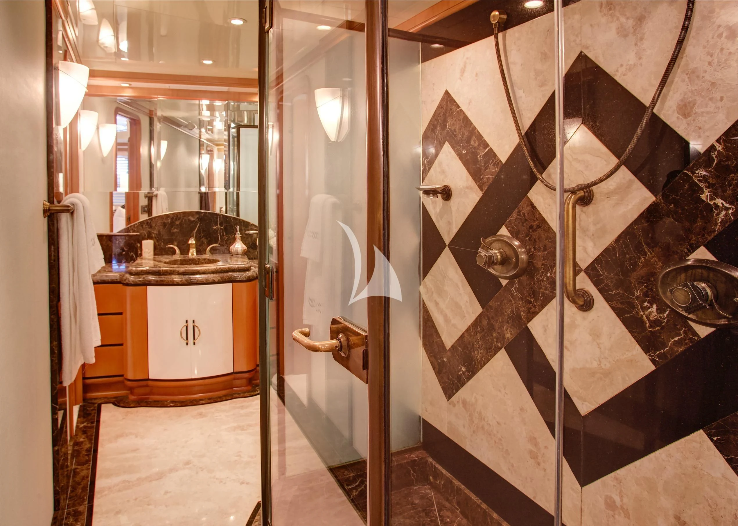 a bathroom with a glass shower aboard XOXO Yacht for Charter