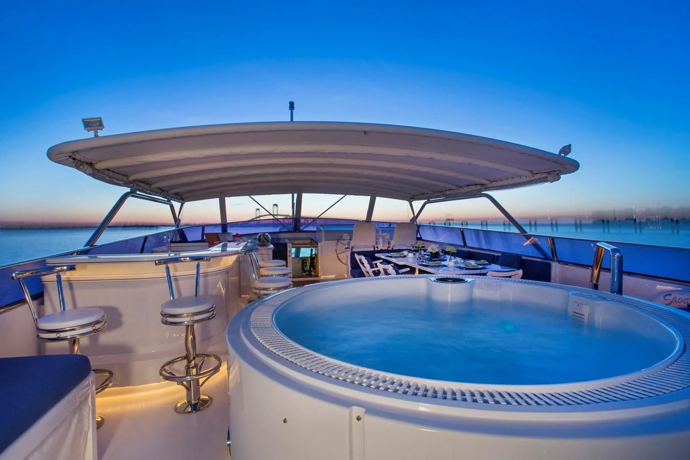a large round white building with a round roof and a pool table aboard XOXO Yacht for Charter