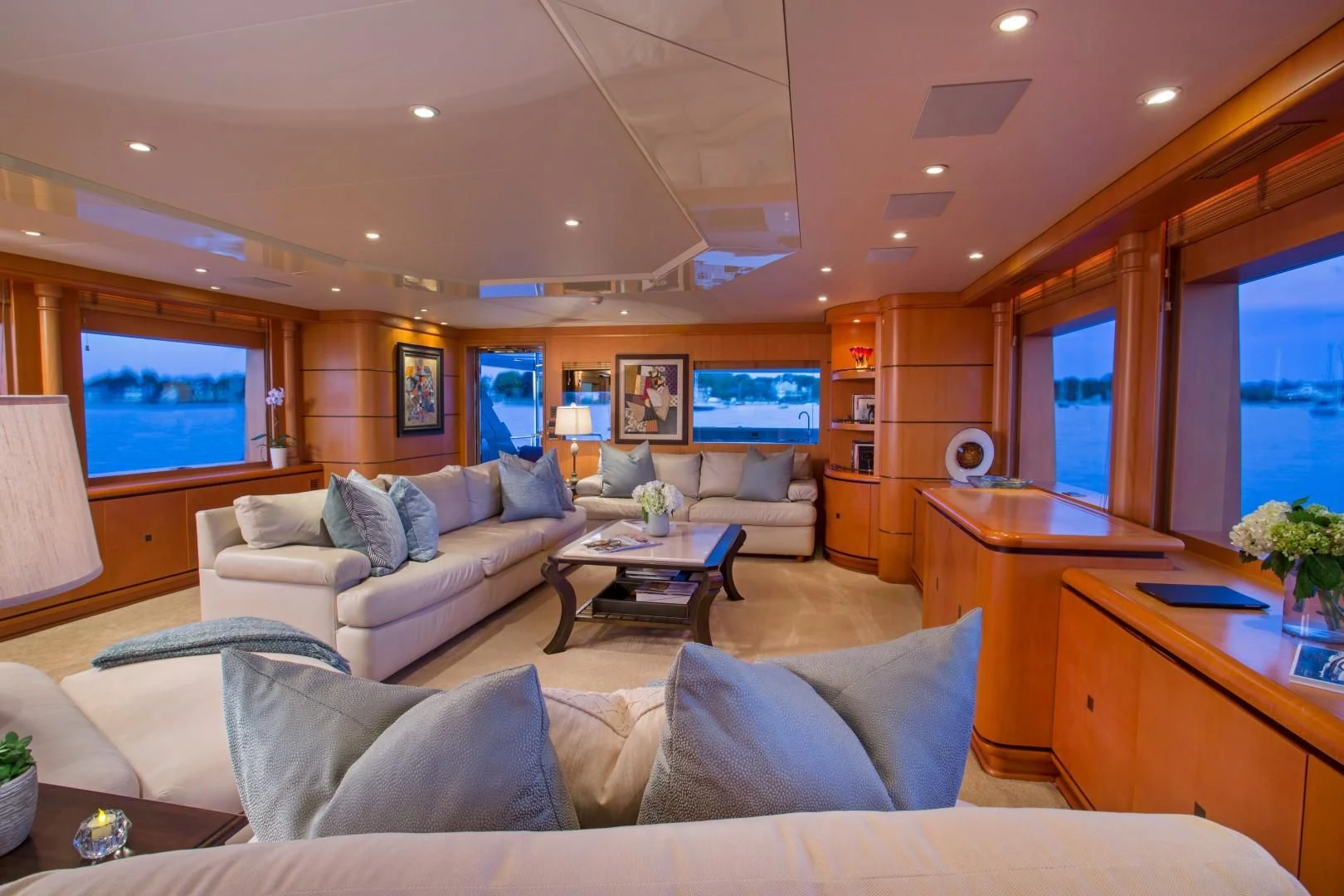 a living room with a couch and a tv aboard XOXO Yacht for Charter