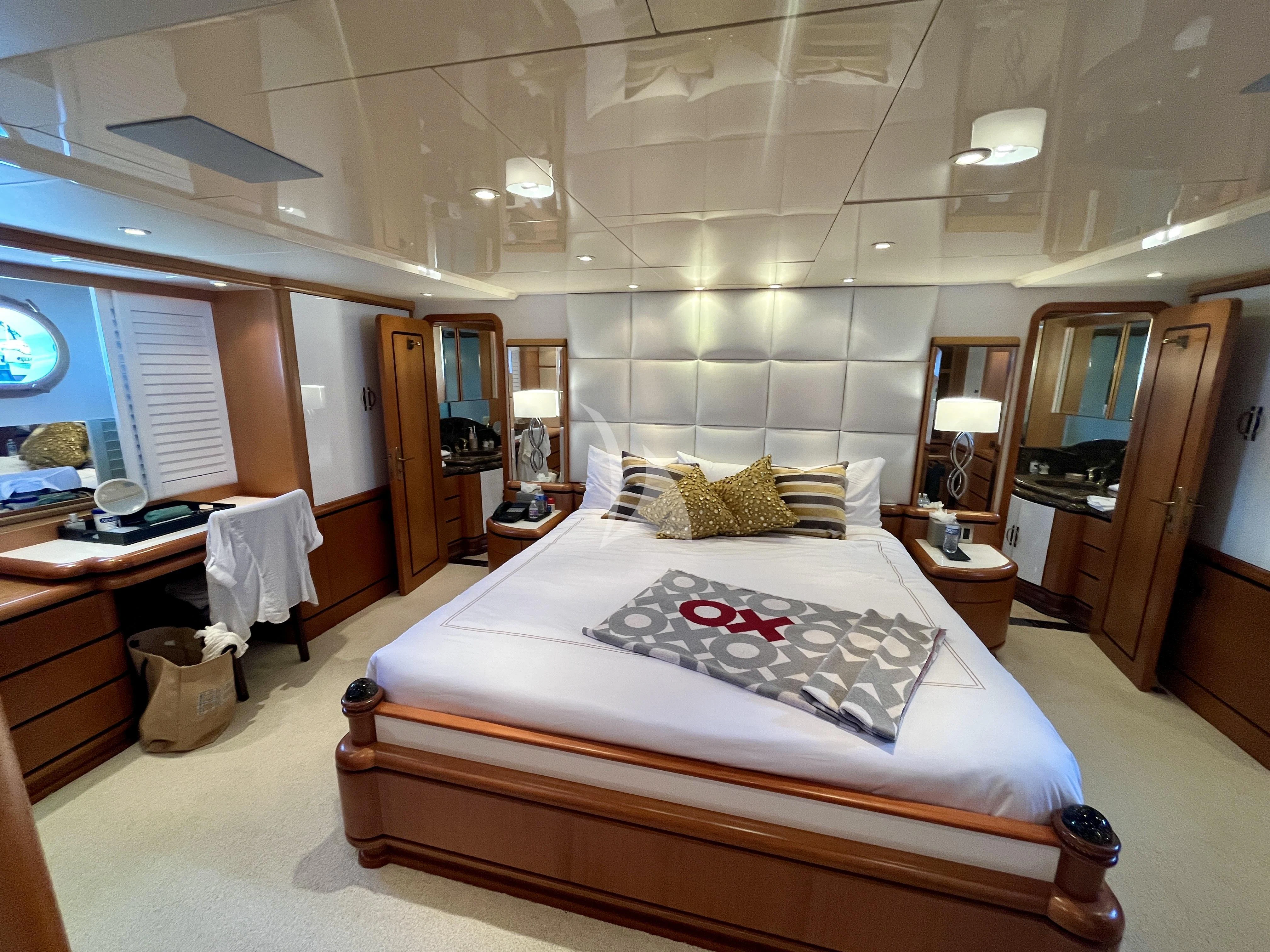 a bed in a hotel room aboard XOXO Yacht for Charter