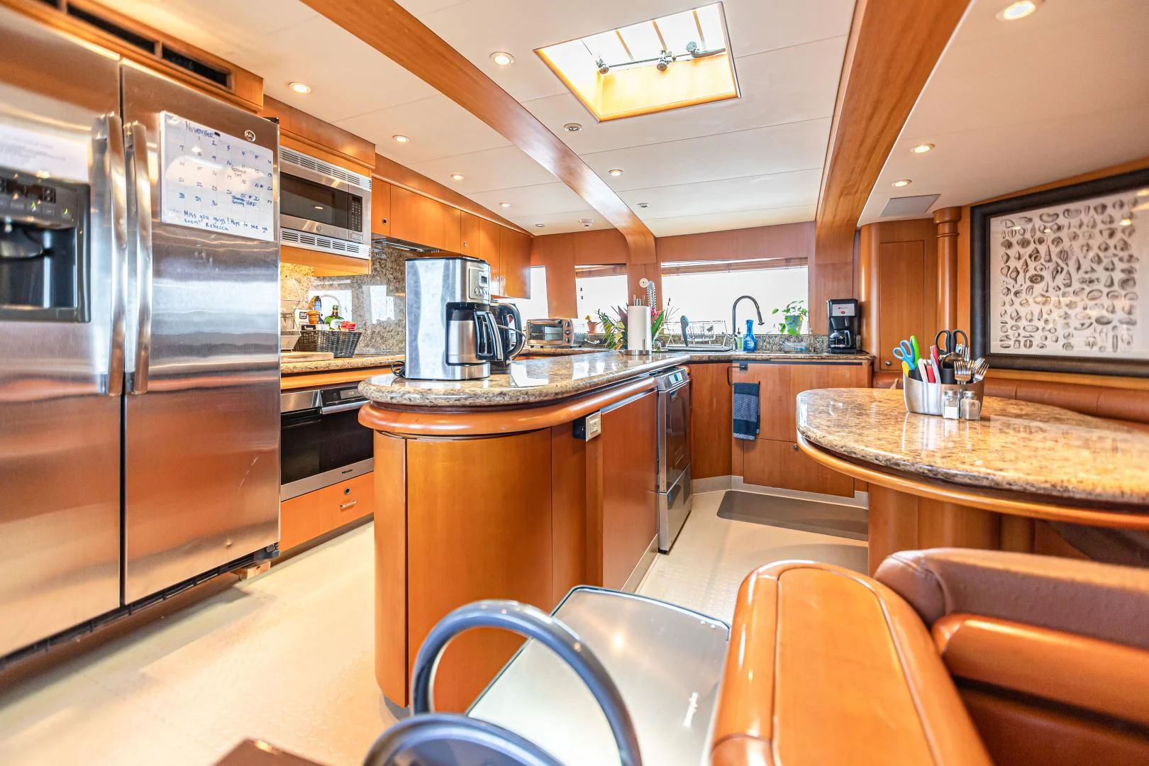 a kitchen with stainless steel appliances aboard XOXO Yacht for Charter