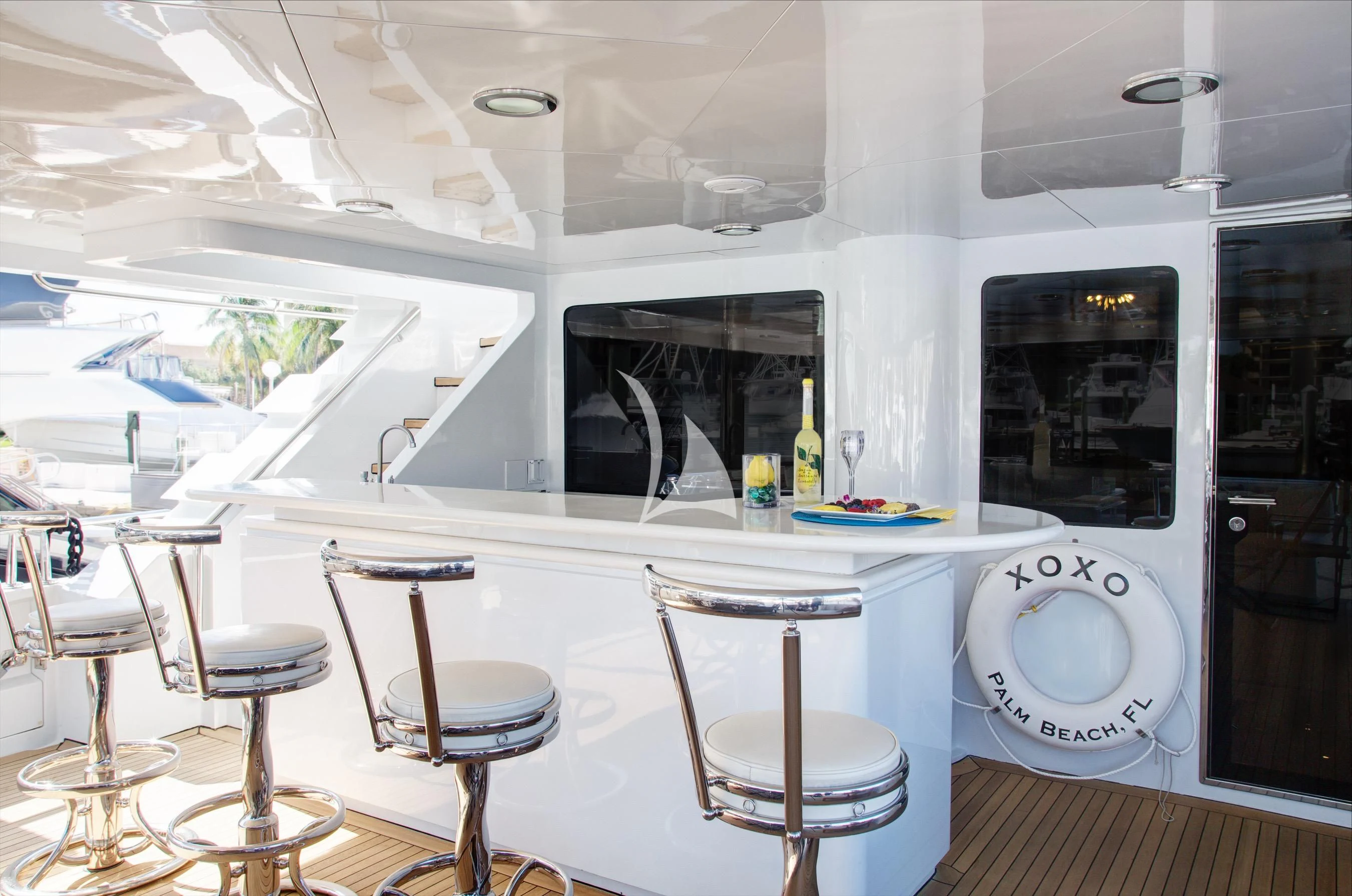 a bathroom with stools and sinks aboard XOXO Yacht for Charter