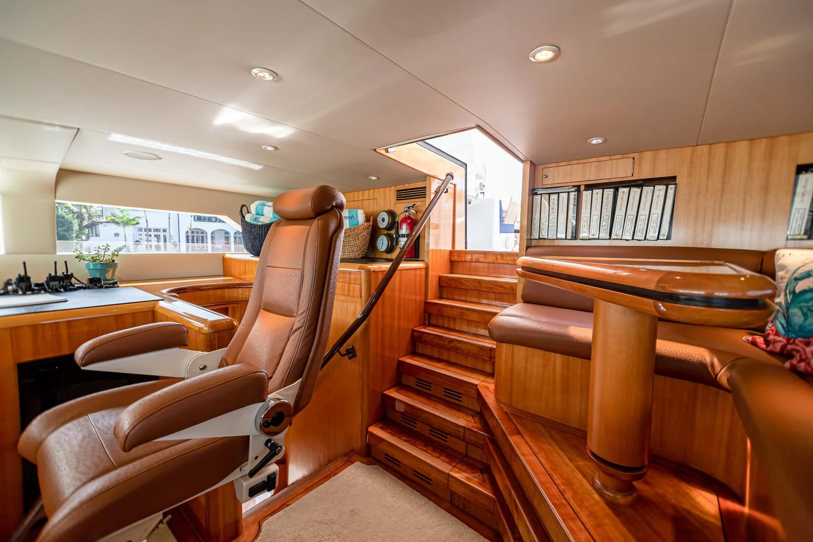 a living room with a wood staircase aboard XOXO Yacht for Charter