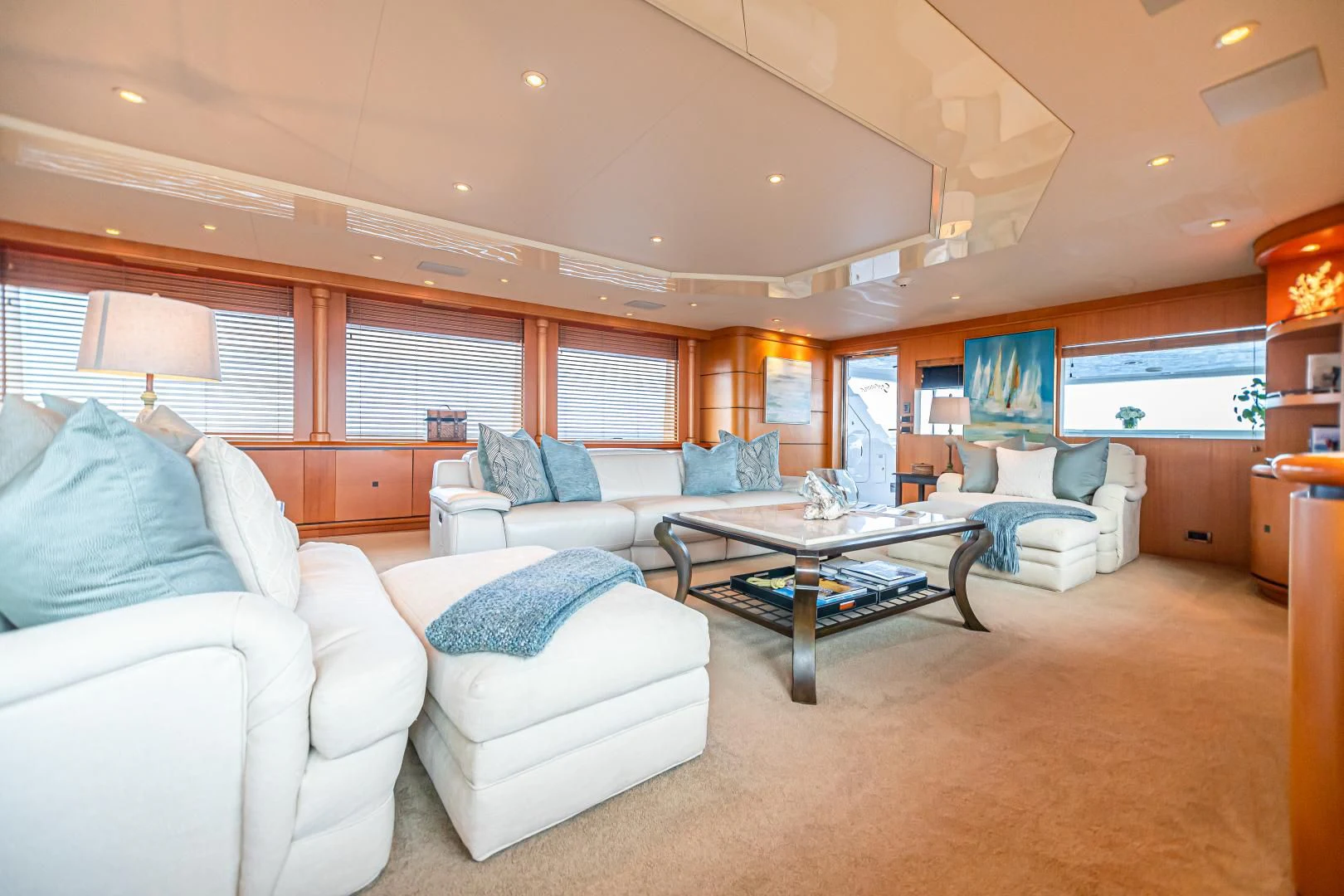 a living room with a large window aboard XOXO Yacht for Charter