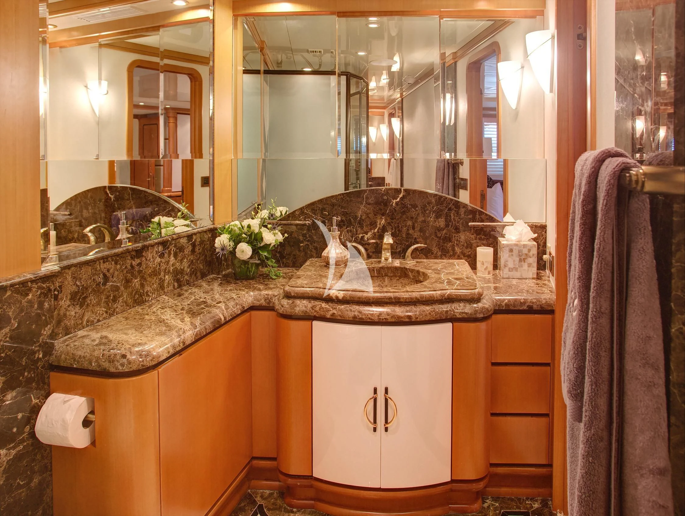 a bathroom with a large sink aboard XOXO Yacht for Charter