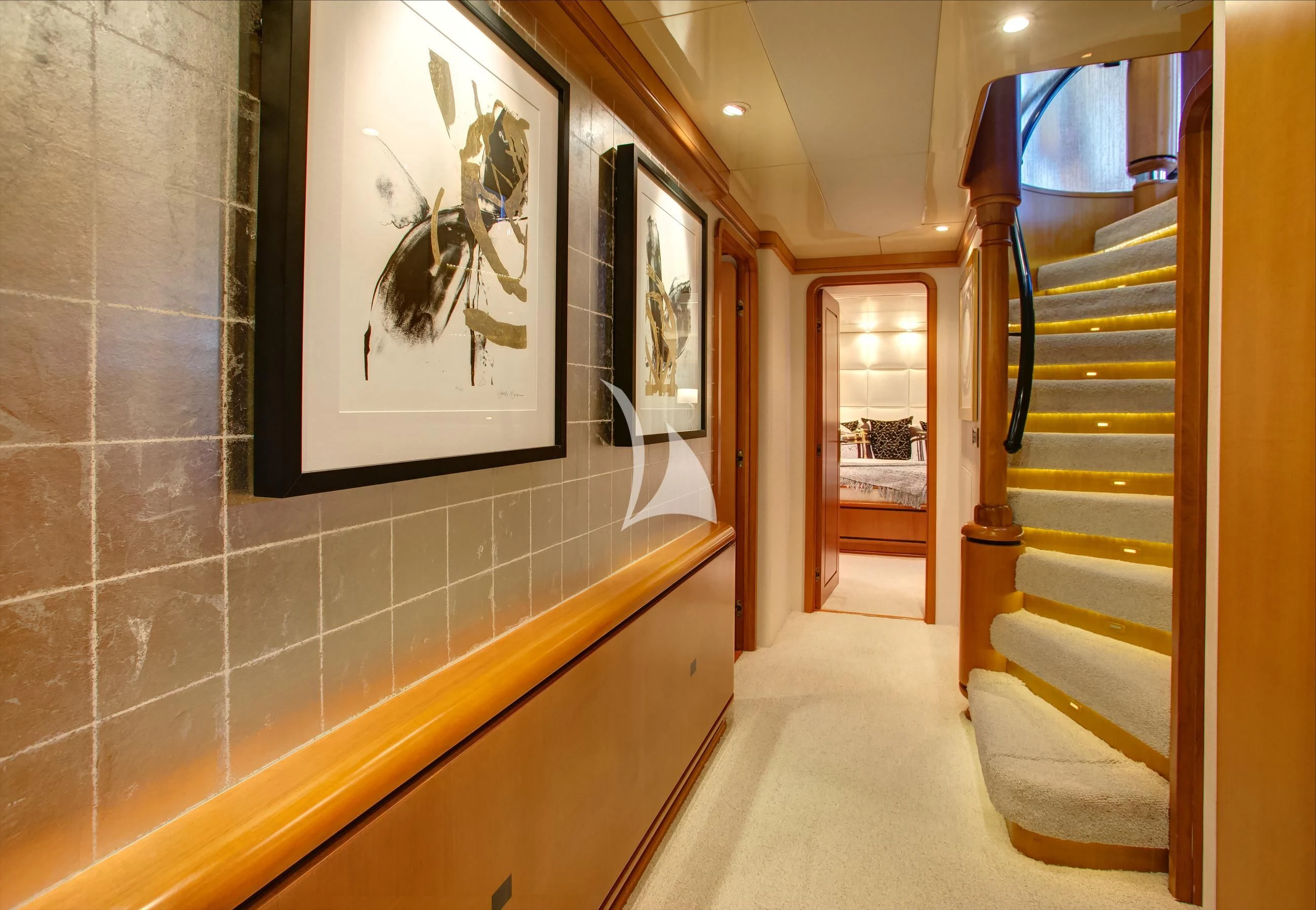 a hallway with a painting on the wall aboard XOXO Yacht for Charter