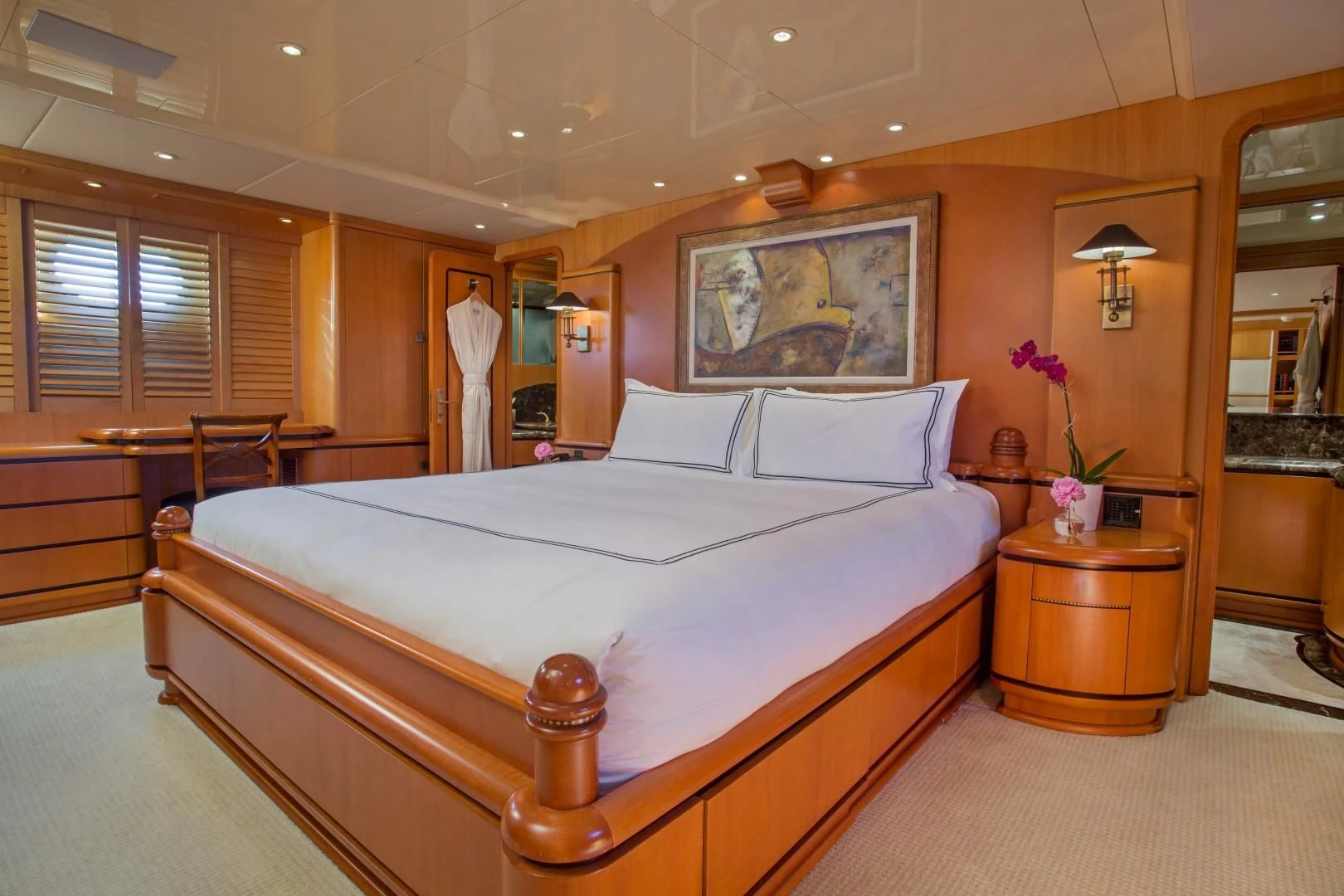 a large bed in a room aboard XOXO Yacht for Charter