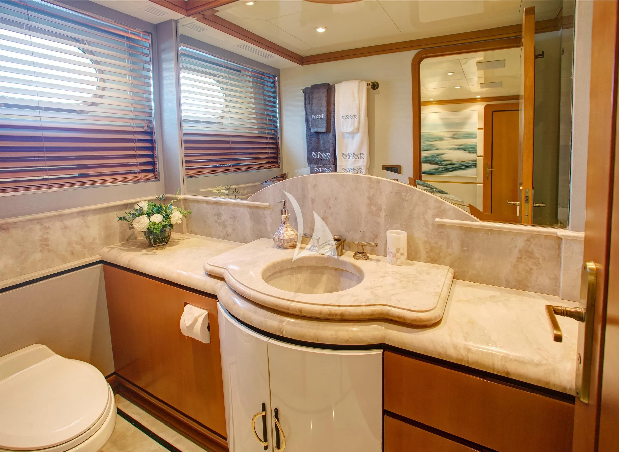 a bathroom with a sink and a toilet aboard XOXO Yacht for Charter