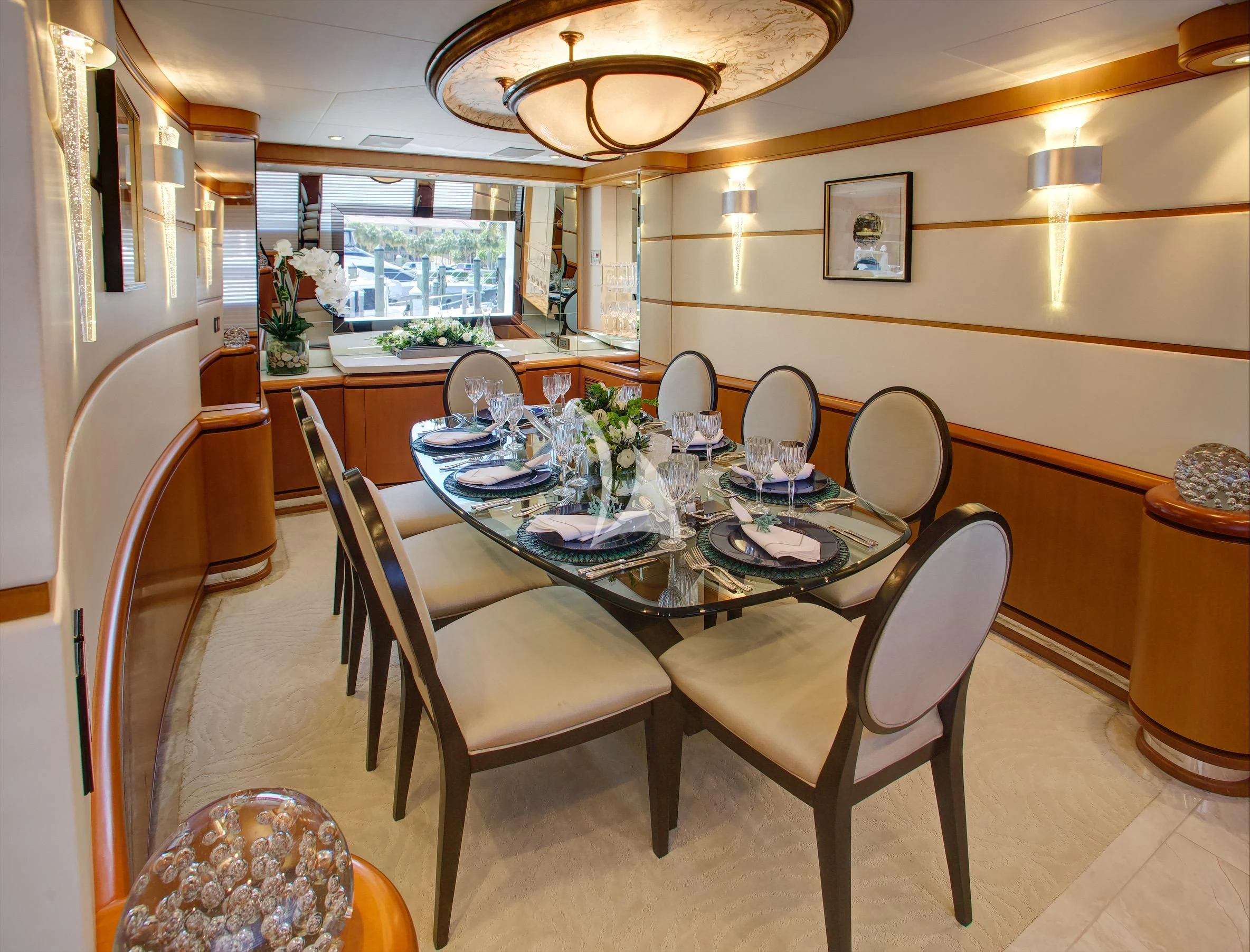 a dining room with a table and chairs aboard XOXO Yacht for Charter